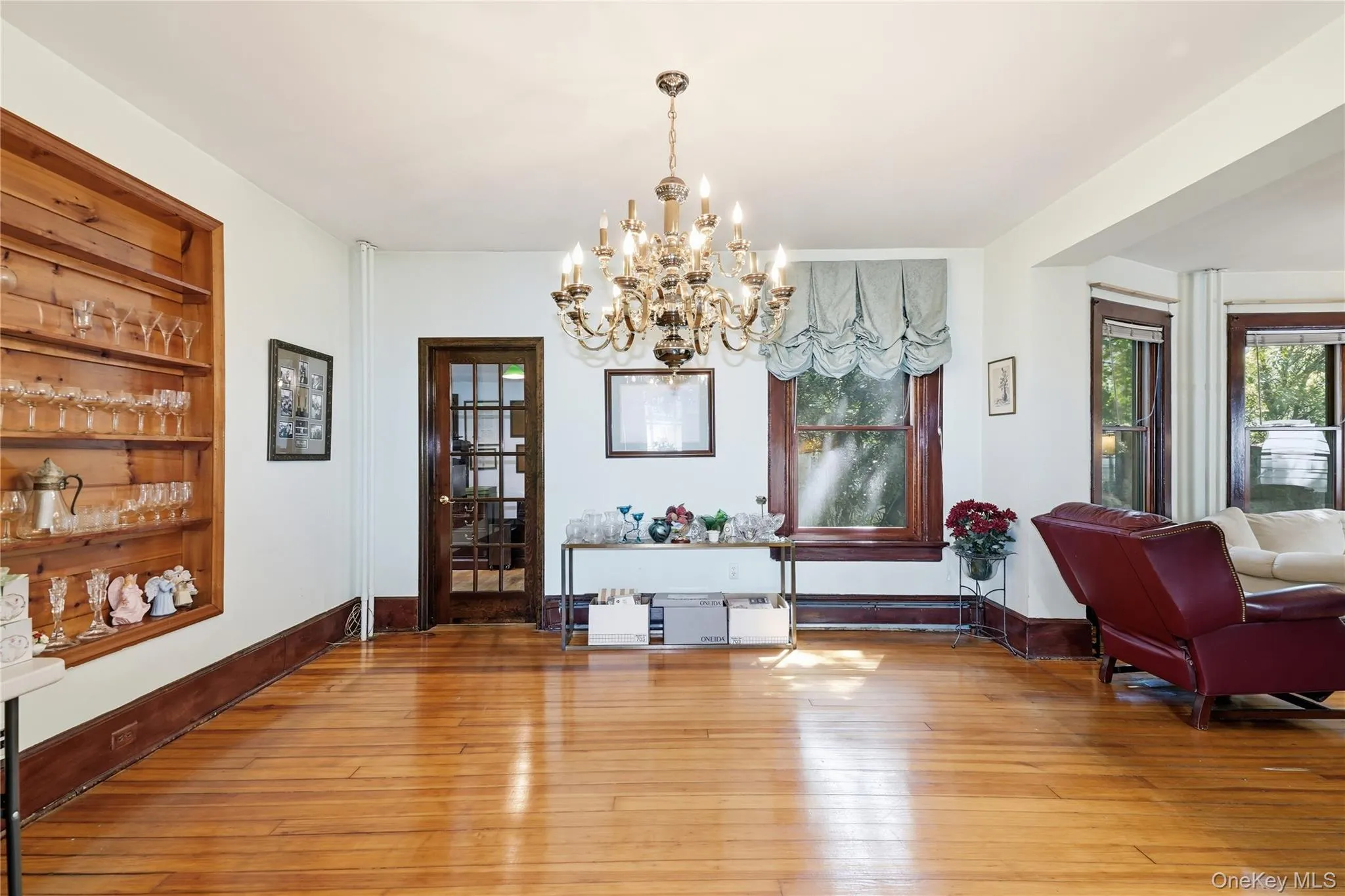 Elegant chandelier highlights this spacious formal dining room Elegant chandelier highlights this spacious formal dining room