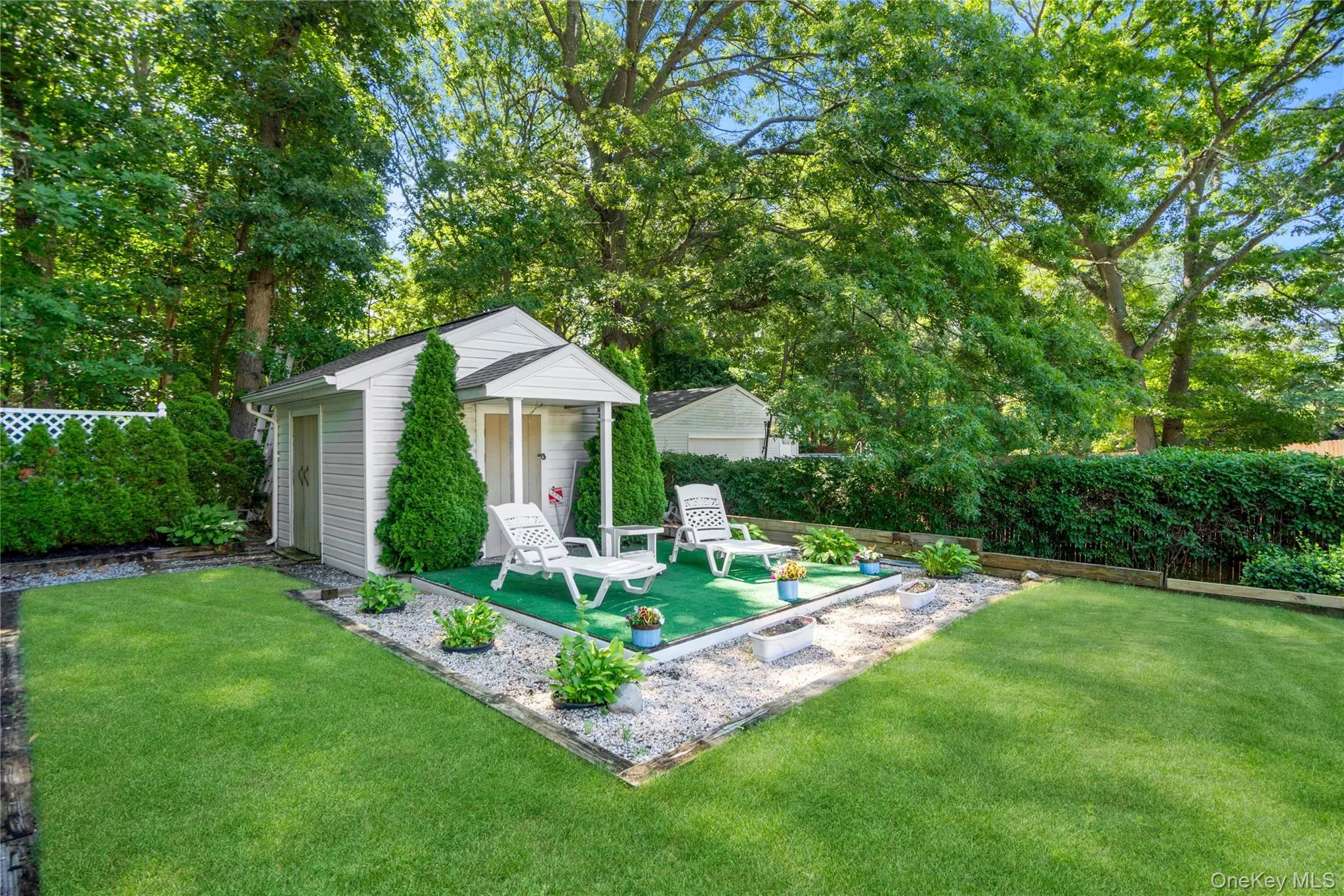 12' x 12' shed with a raised platform, two separate entrances, a loft, full electric, a portico awning, and an alarm system. 12' x 12' shed with a raised platform, two separate entrances, a loft, full electric, a portico awning, and an alarm system.
