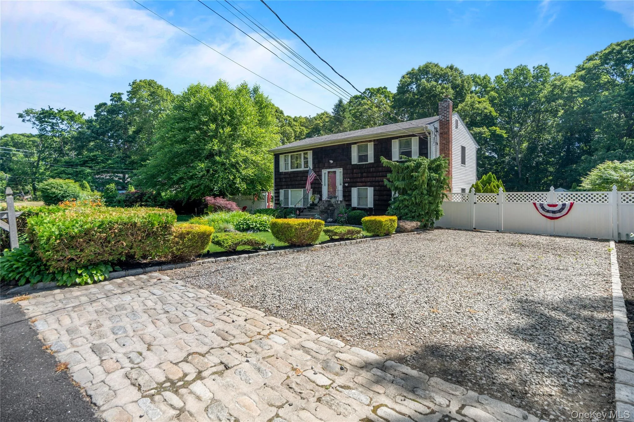 Expanded driveway accommodates up to four cars. Expanded driveway accommodates up to four cars.