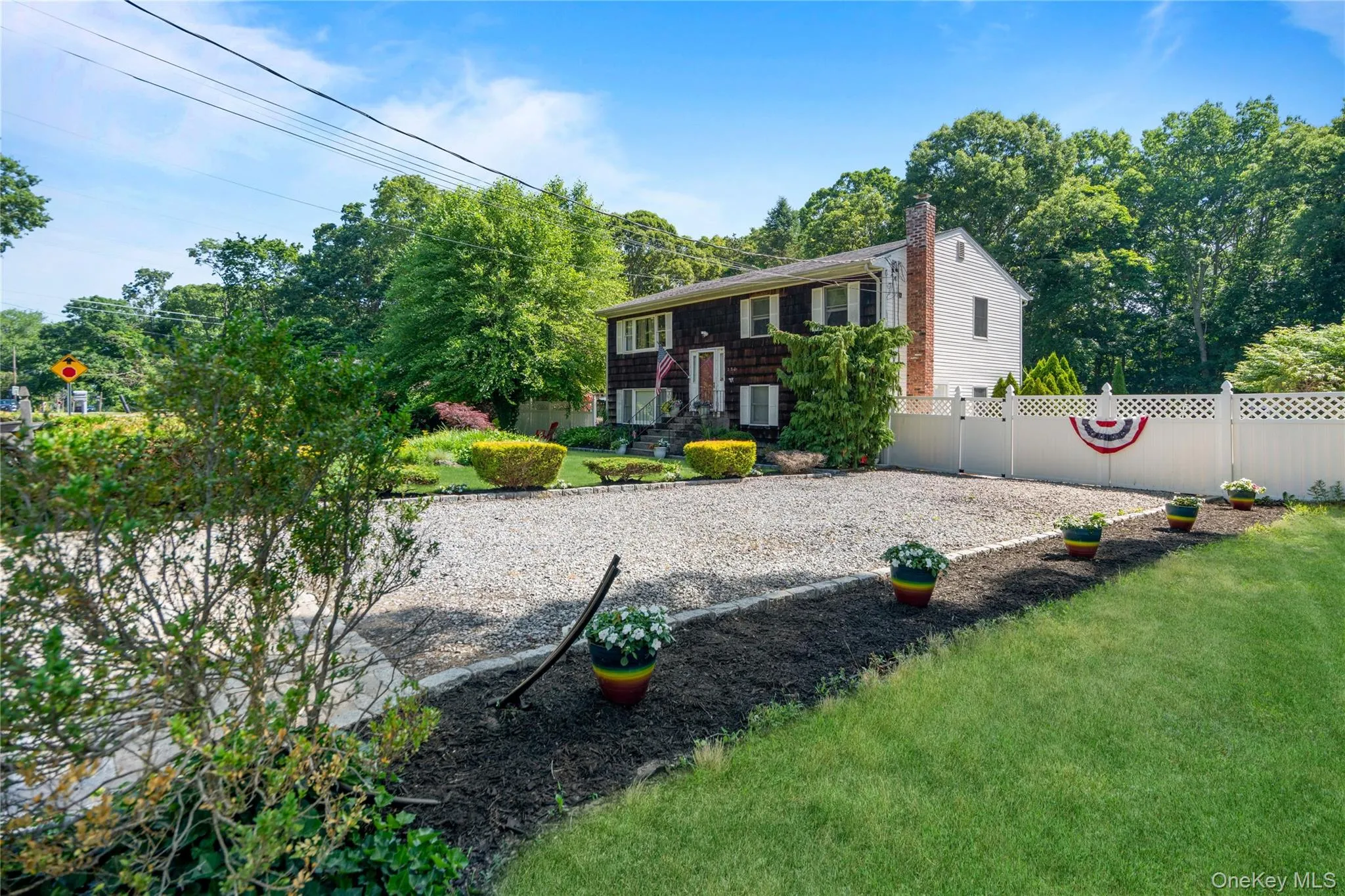 Expanded driveway accommodates up to four cars. Expanded driveway accommodates up to four cars.
