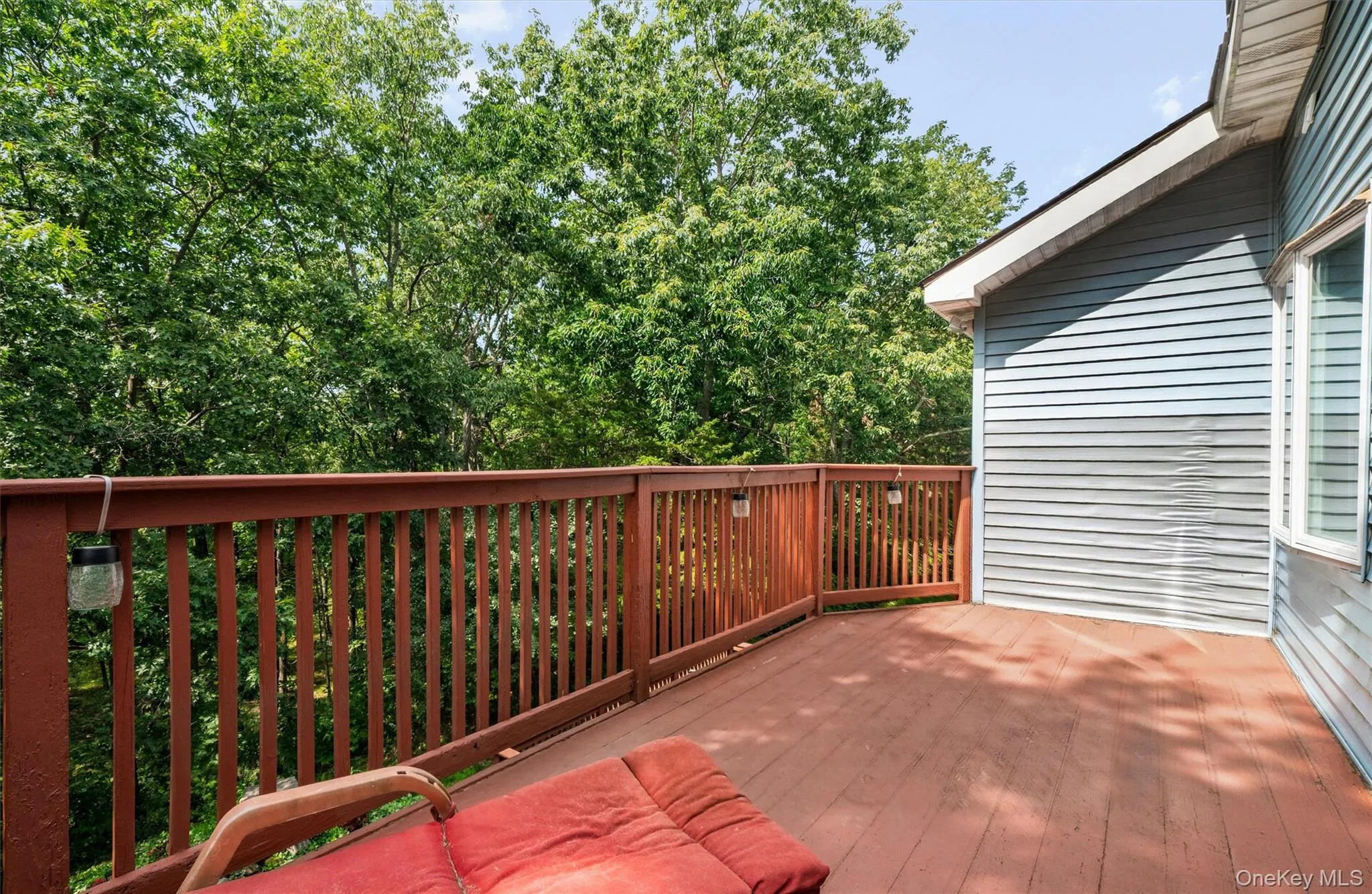 Deck off of primary bedroom overlooking koi pond Deck off of primary bedroom overlooking koi pond
