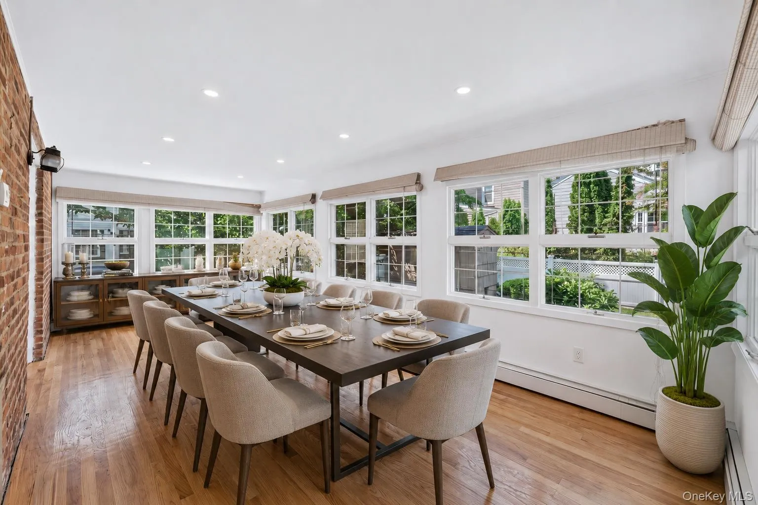 Virtually staged dining room area in Sunroom Virtually staged dining room area in Sunroom