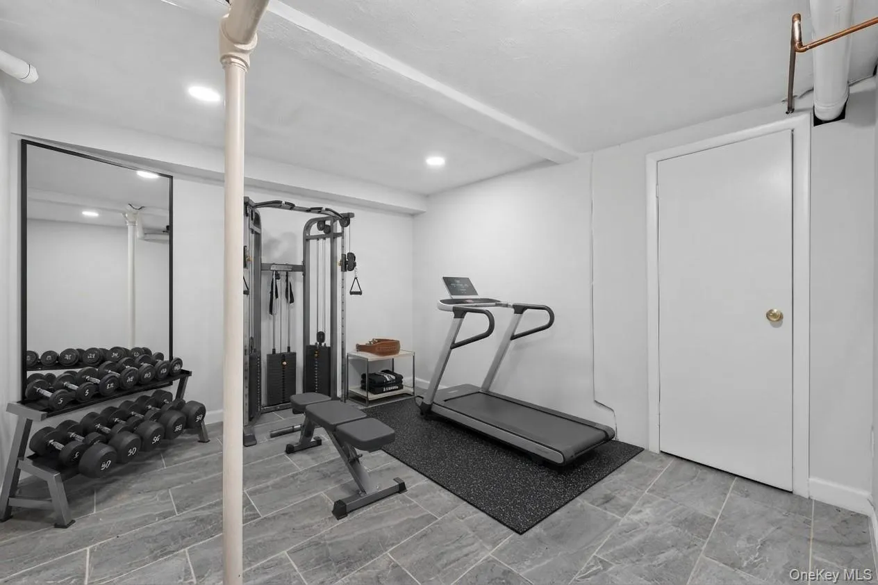Virtually staged gym in basement area Virtually staged gym in basement area
