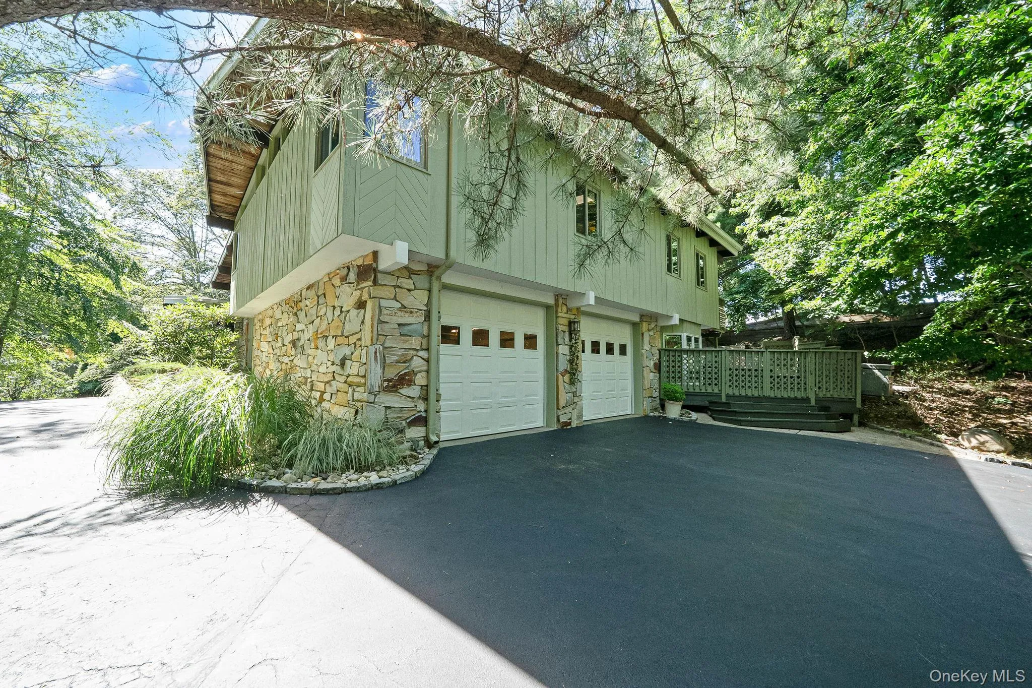 Stone and siding exterior with a two-car garage Stone and siding exterior with a two-car garage