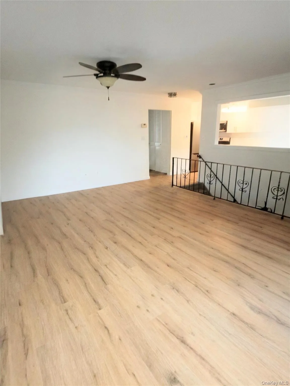 Large living room with sliders to deck Large living room with sliders to deck