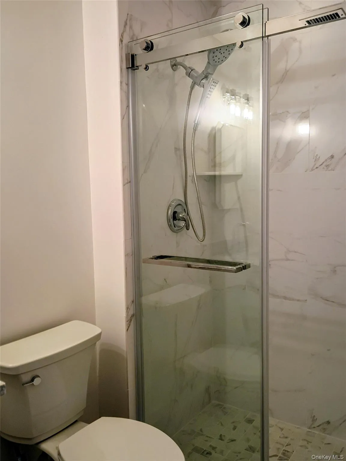 Full bath off primary bedroom. New, Ceramic tiled Full bath off primary bedroom. New, Ceramic tiled