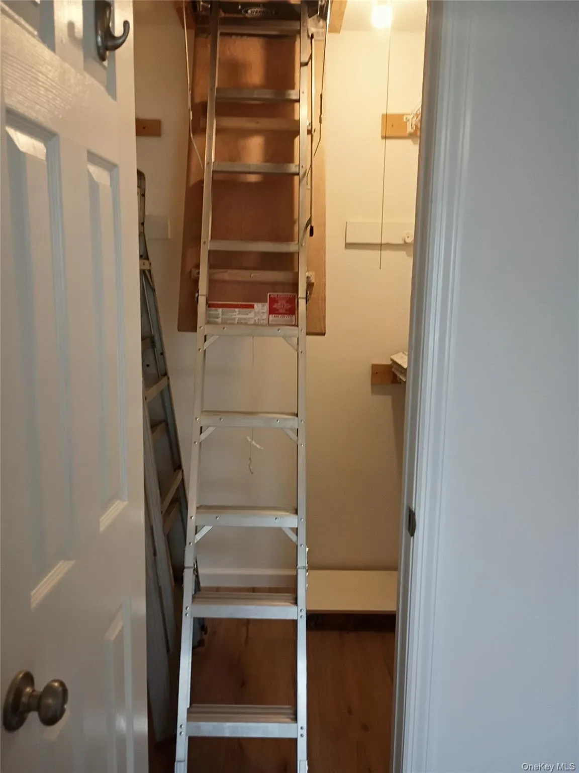 Walk in closet in Master with pull down stairs to attic for extra storage Walk in closet in Master with pull down stairs to attic for extra storage