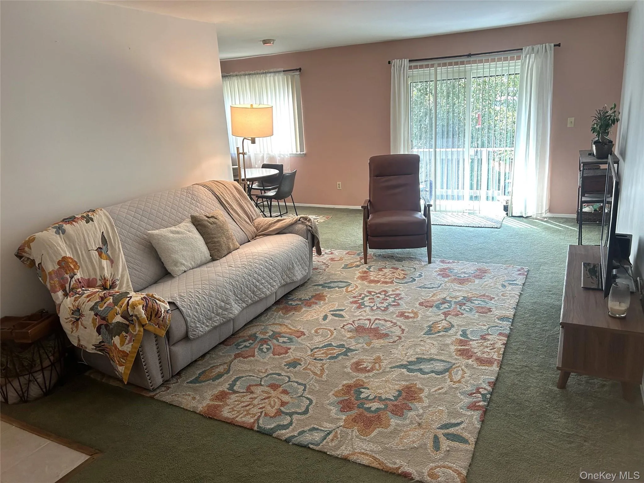 Living Room with access to deck. Living Room with access to deck.