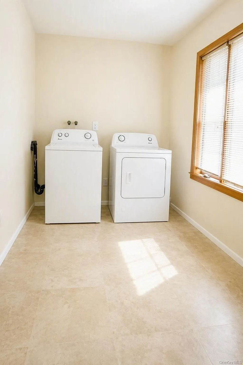 Dedicated laundry area conveniently located on the main living level - there's a window offering lots of natural light. Dedicated laundry area conveniently located on the main living level - there's a window offering lots of natural light.