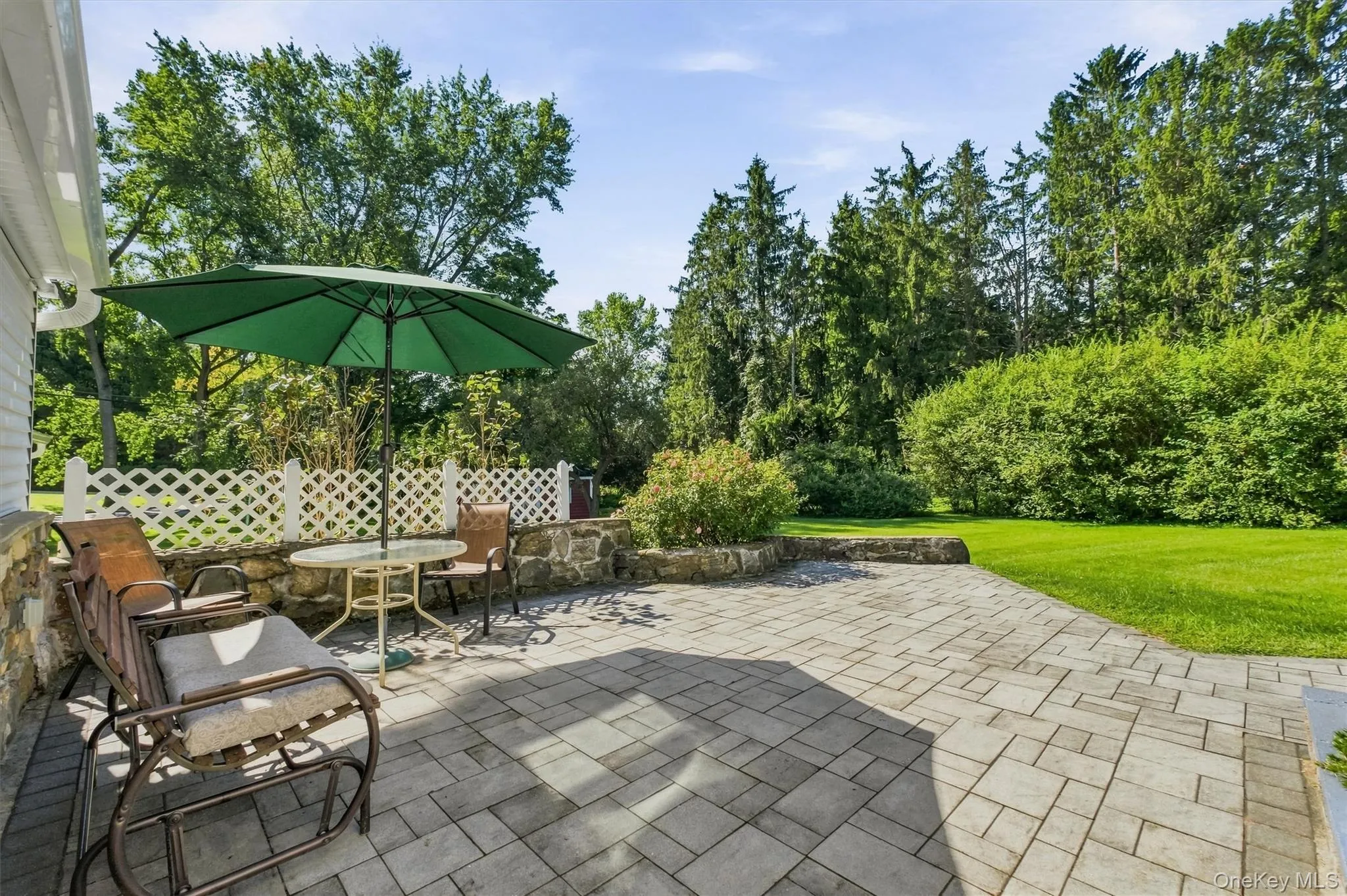 Expansive patio done in pavers adds nice character to backyard and perfect for entertaining Expansive patio done in pavers adds nice character to backyard and perfect for entertaining