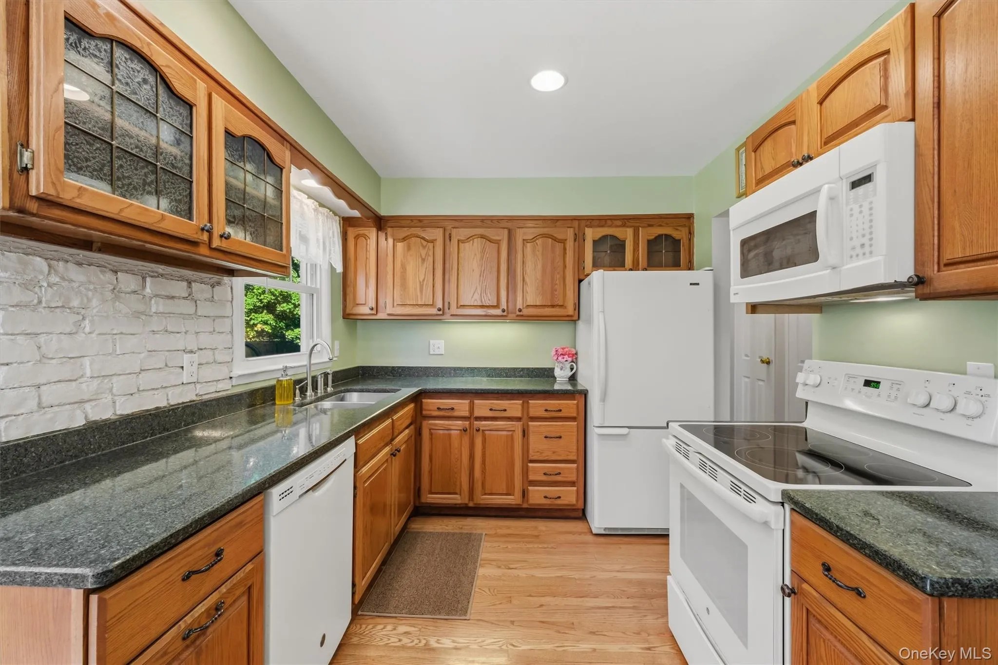 Kitchen with oak cabinets and silestone counters Kitchen with oak cabinets and silestone counters