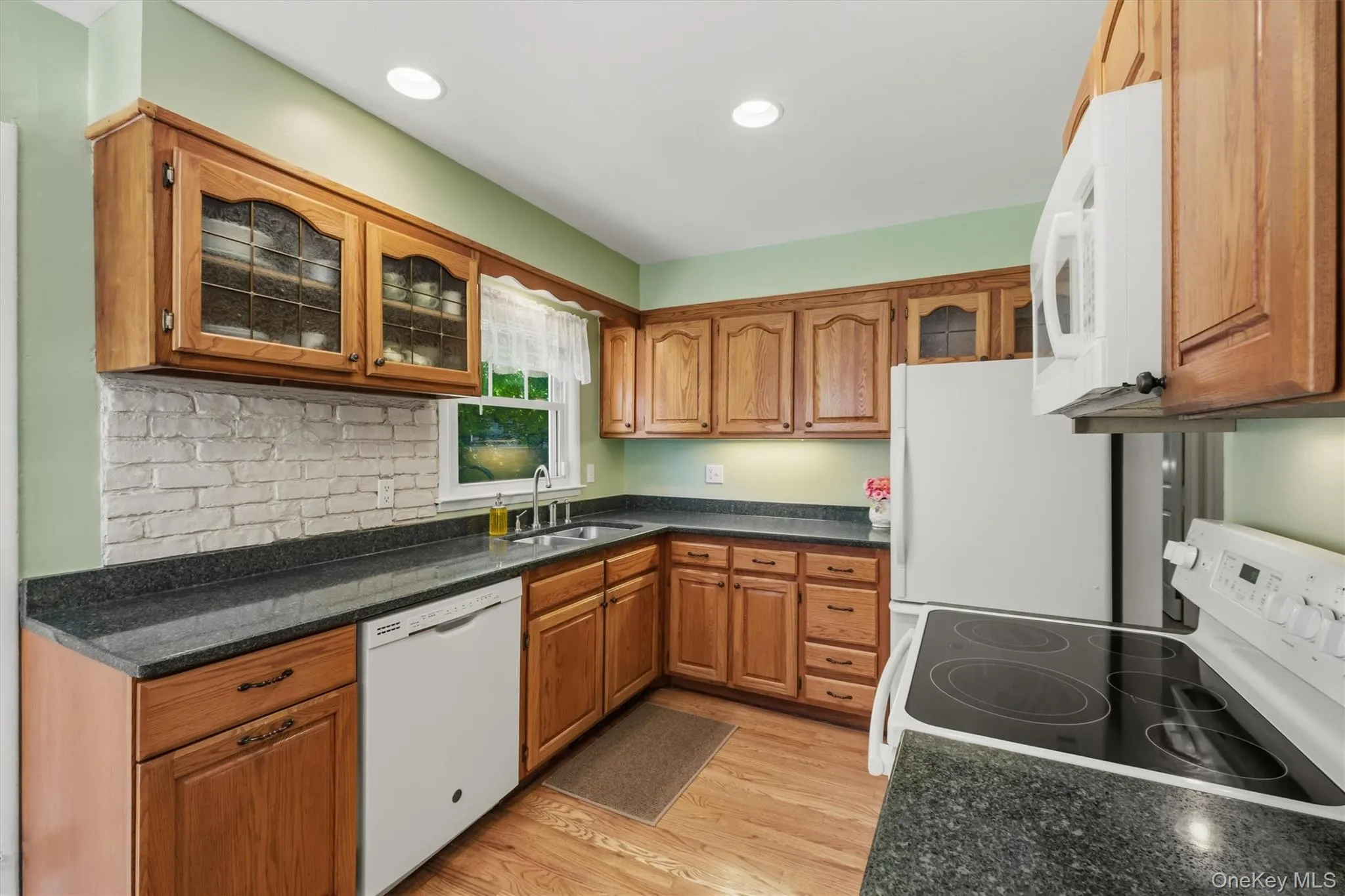 Kitchen with oak cabinets and silestone counters Kitchen with oak cabinets and silestone counters