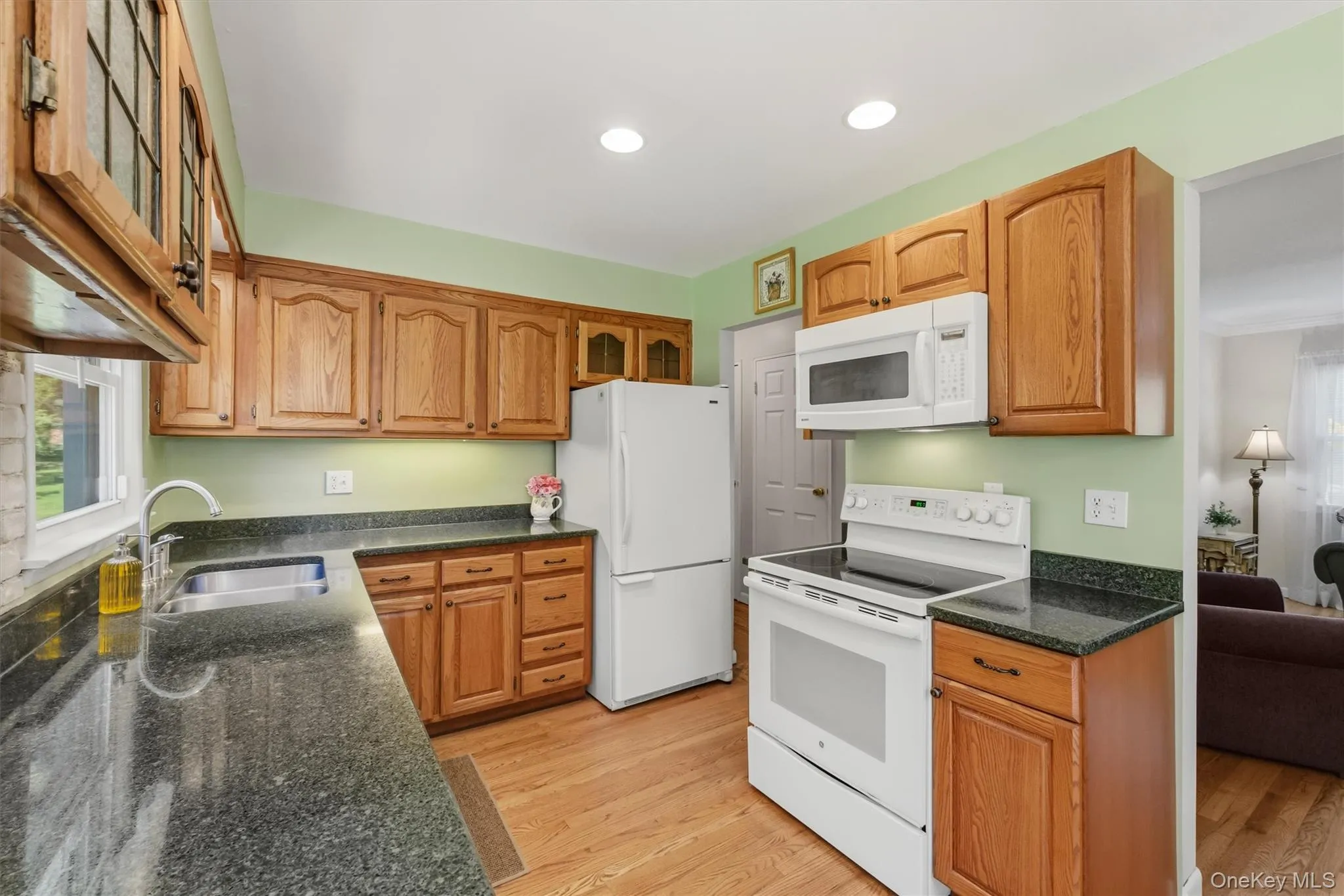 Kitchen with oak cabinets and silestone counters Kitchen with oak cabinets and silestone counters