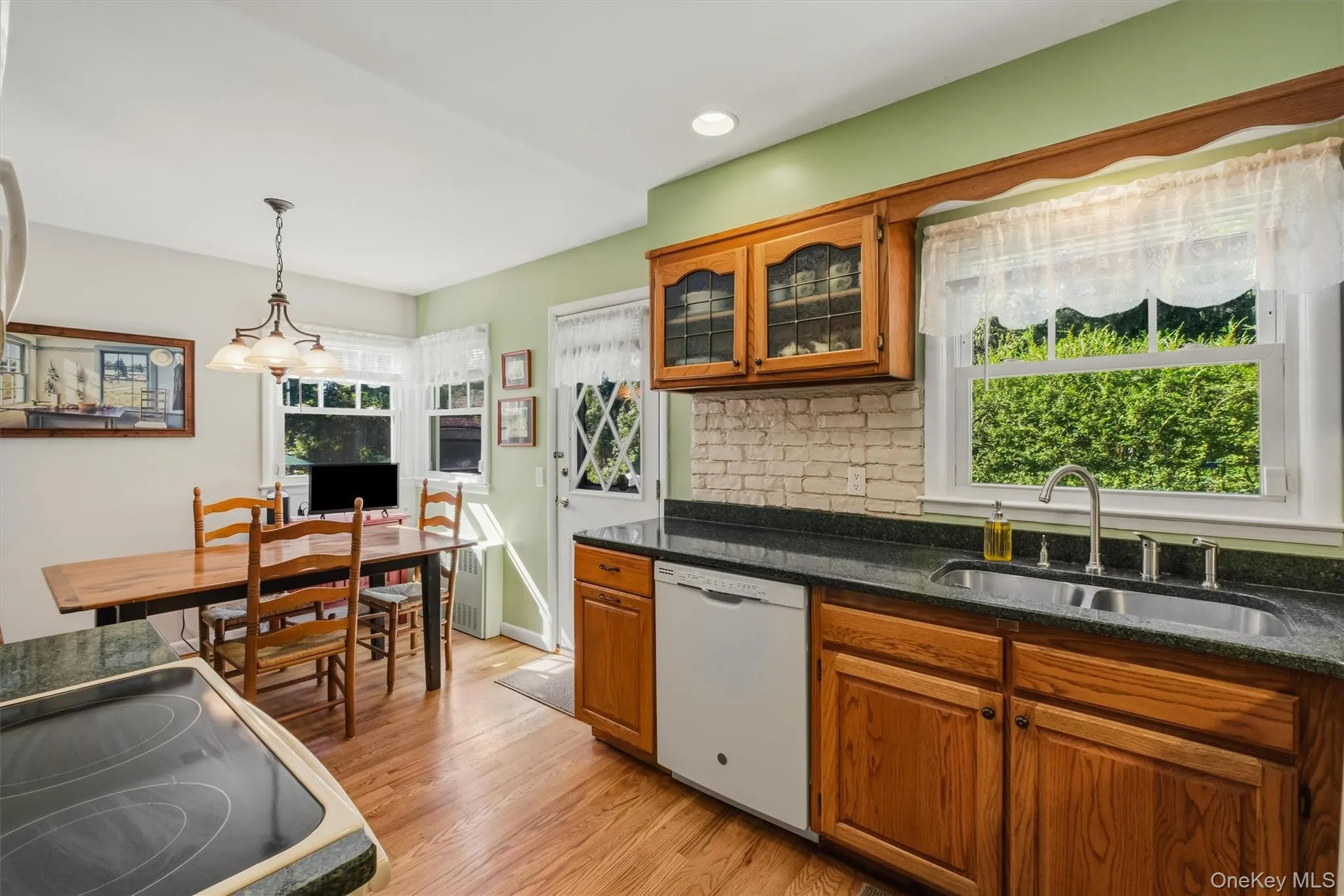 Kitchen with oak cabinets and silestone counters Kitchen with oak cabinets and silestone counters