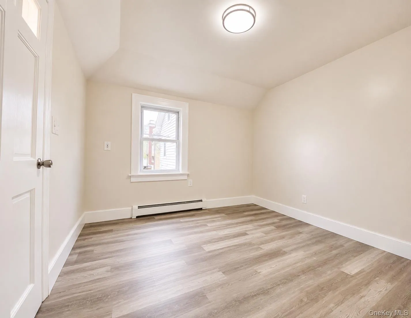 Second level bedroom. The doorway steps out onto a deck with stairway. Second level bedroom. The doorway steps out onto a deck with stairway.