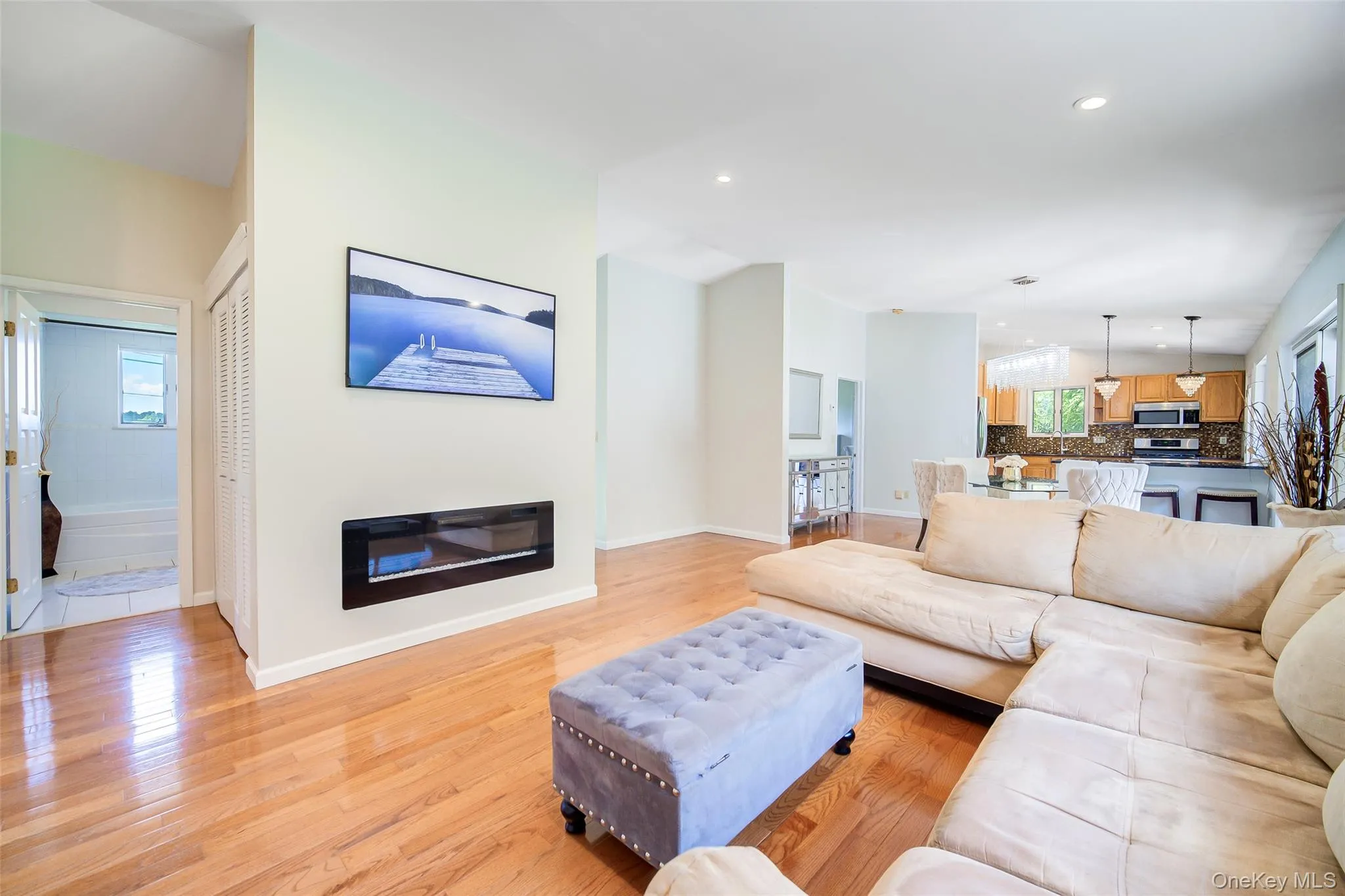 Built in fireplace ,recessed lighting illuminates hardwood flooring and brings warmth to every room Built in fireplace ,recessed lighting illuminates hardwood flooring and brings warmth to every room