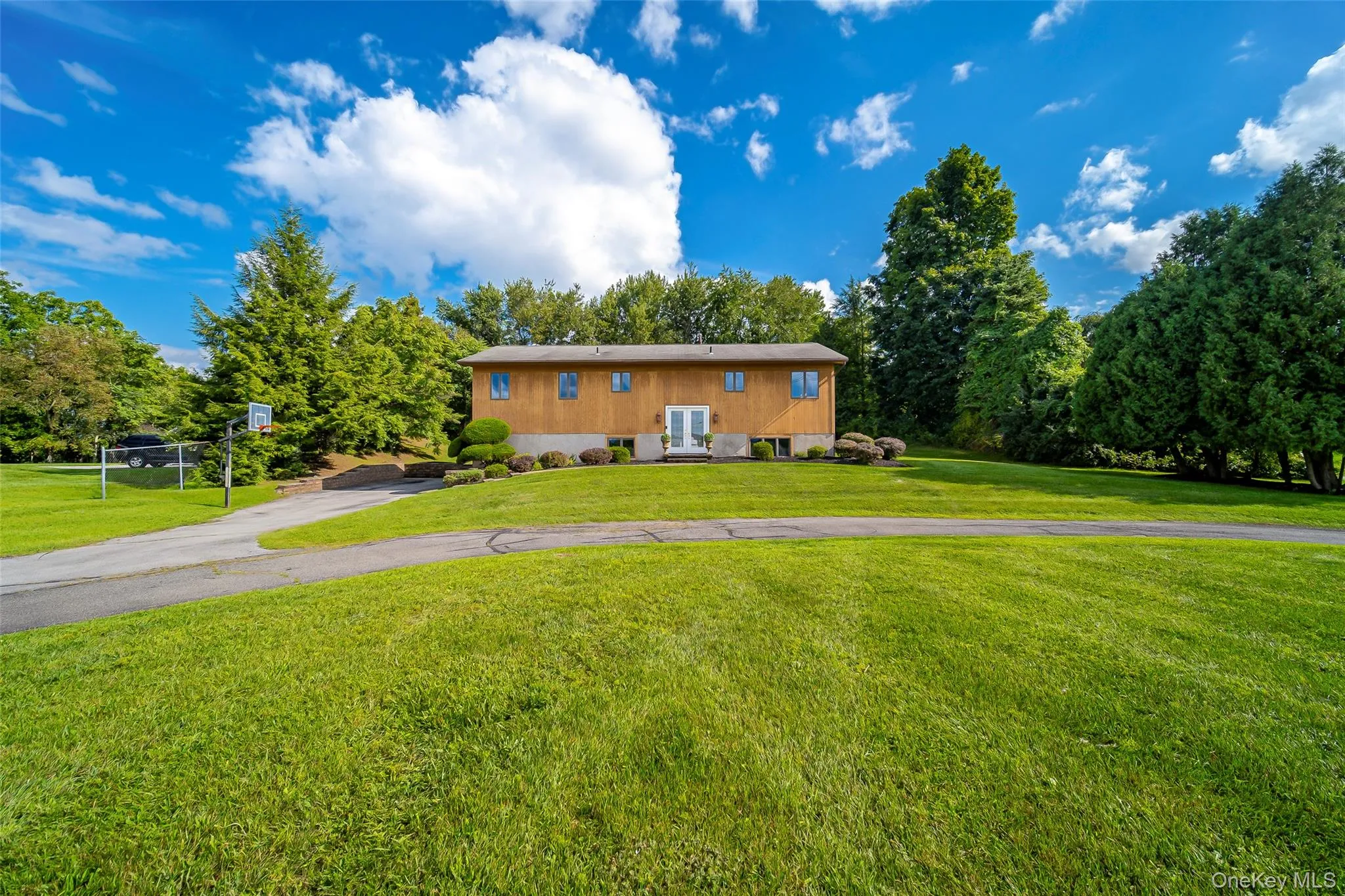 Sprawling front yard with circular drive Sprawling front yard with circular drive
