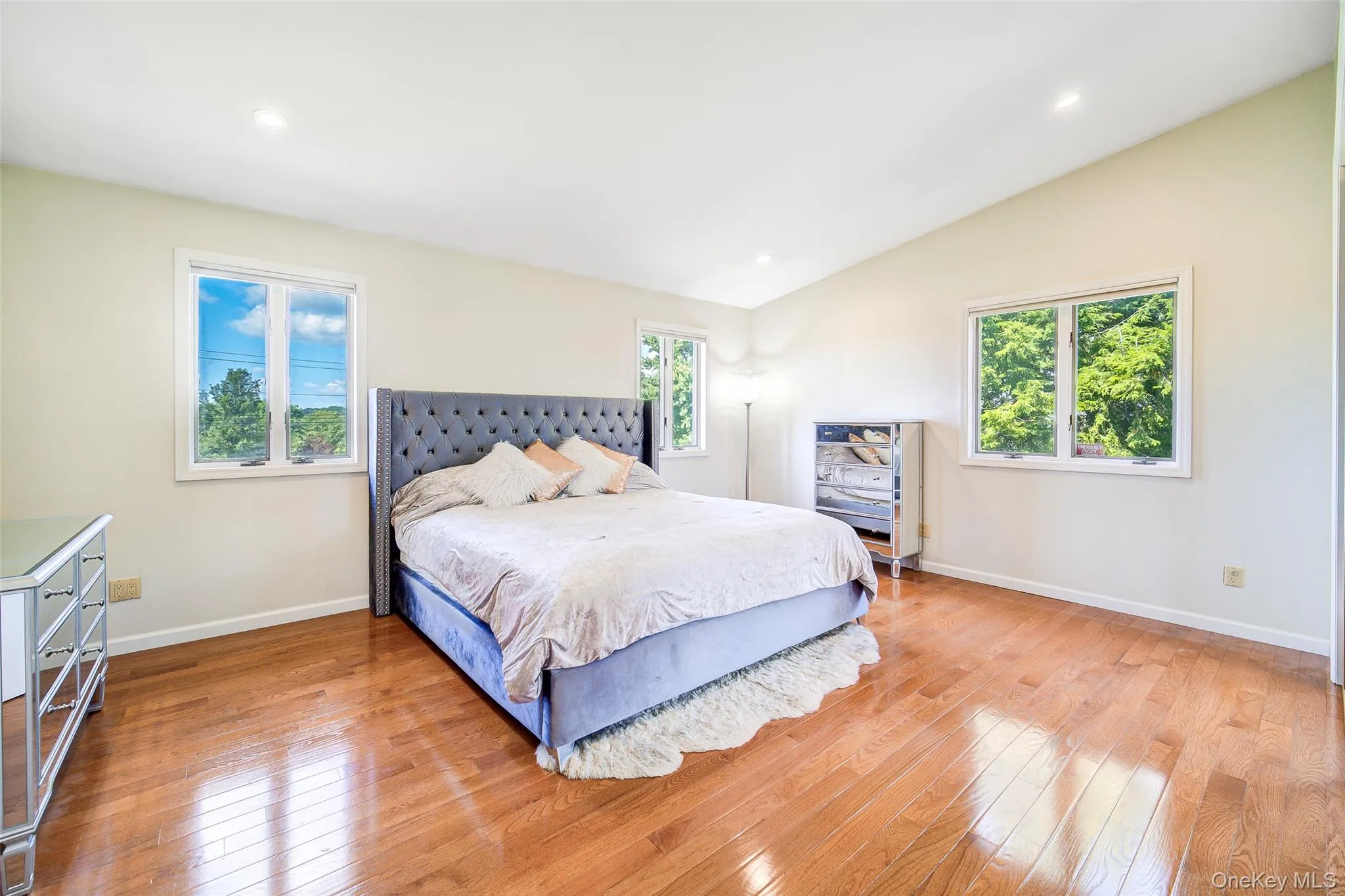 Vaulted ceiling, recessed lighting, wood-finish flooring, multiple windows, neutral wall tones Vaulted ceiling, recessed lighting, wood-finish flooring, multiple windows, neutral wall tones