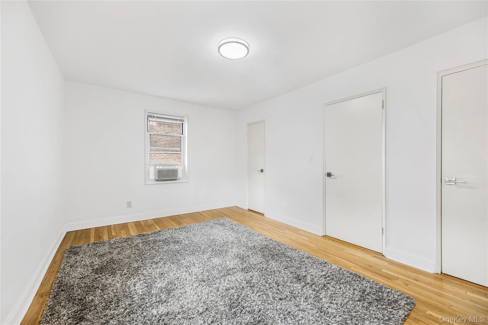 Unfurnished bedroom with two closets Unfurnished bedroom with two closets