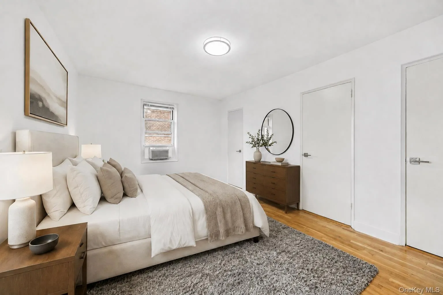 Virtually staged bedroom with two closets Virtually staged bedroom with two closets
