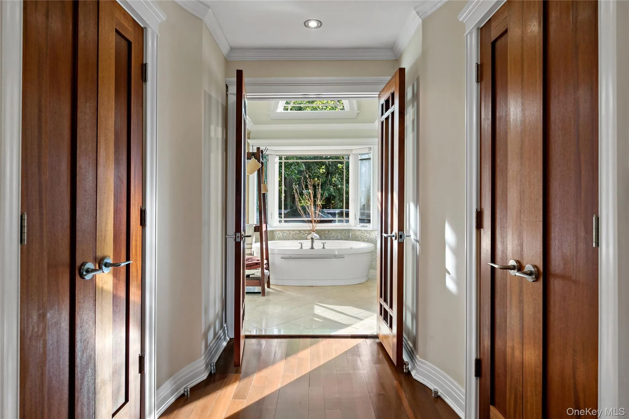 Two Walk-in Primary Cedar Closets with a Peak into the Primary Bath Two Walk-in Primary Cedar Closets with a Peak into the Primary Bath