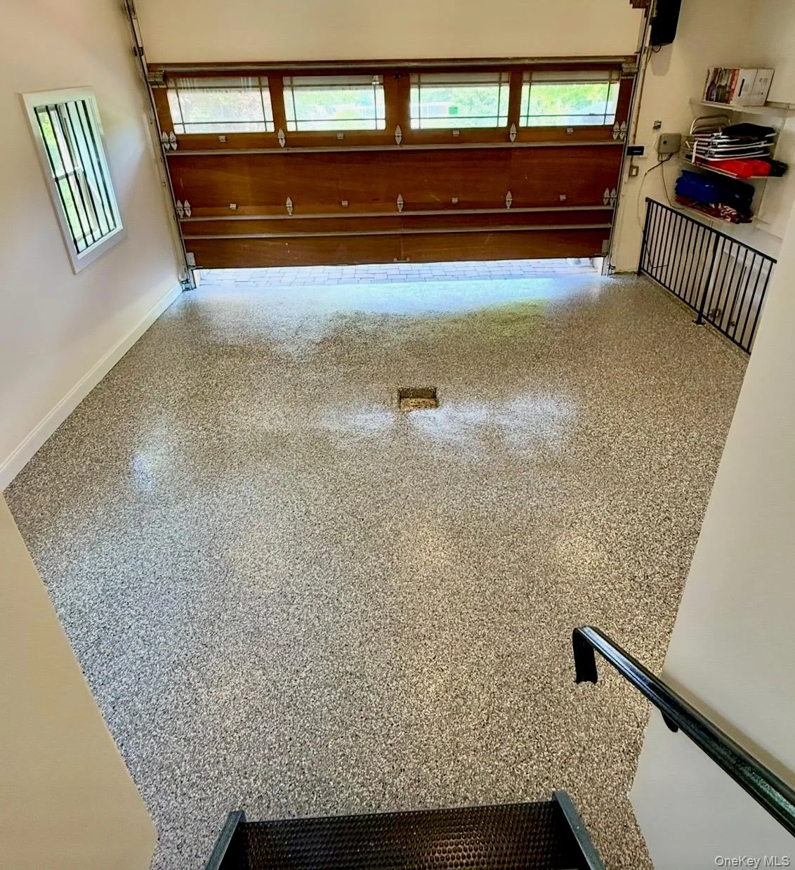Two-Car Heated Garage with Epoxy Floor Accessed from the Kitchen and Lower Level Two-Car Heated Garage with Epoxy Floor Accessed from the Kitchen and Lower Level