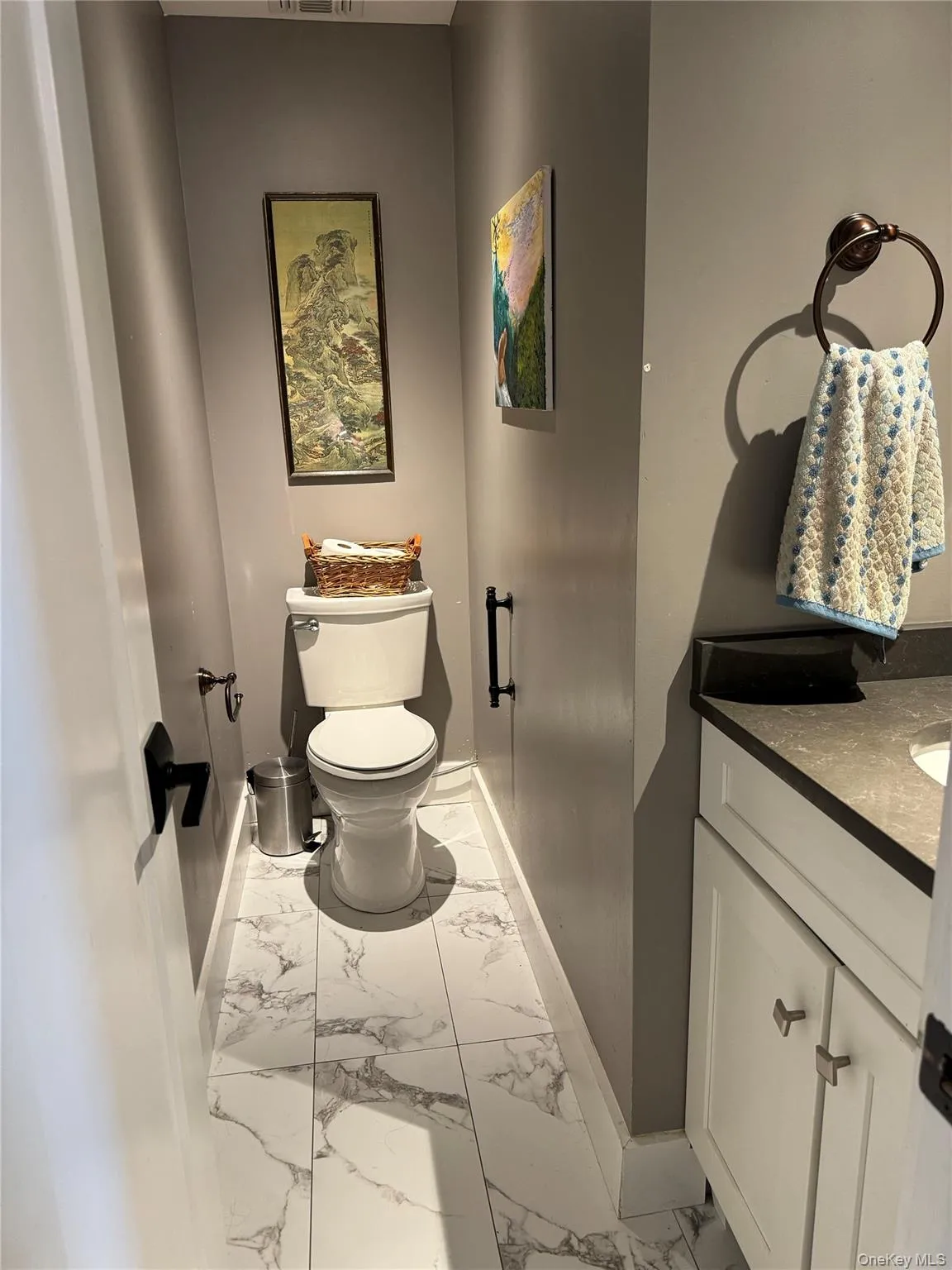 Bathroom with light marble finish floors and vanity Bathroom with light marble finish floors and vanity