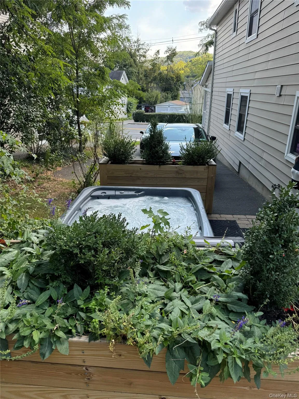 View of storm shelter with a hot tub View of storm shelter with a hot tub