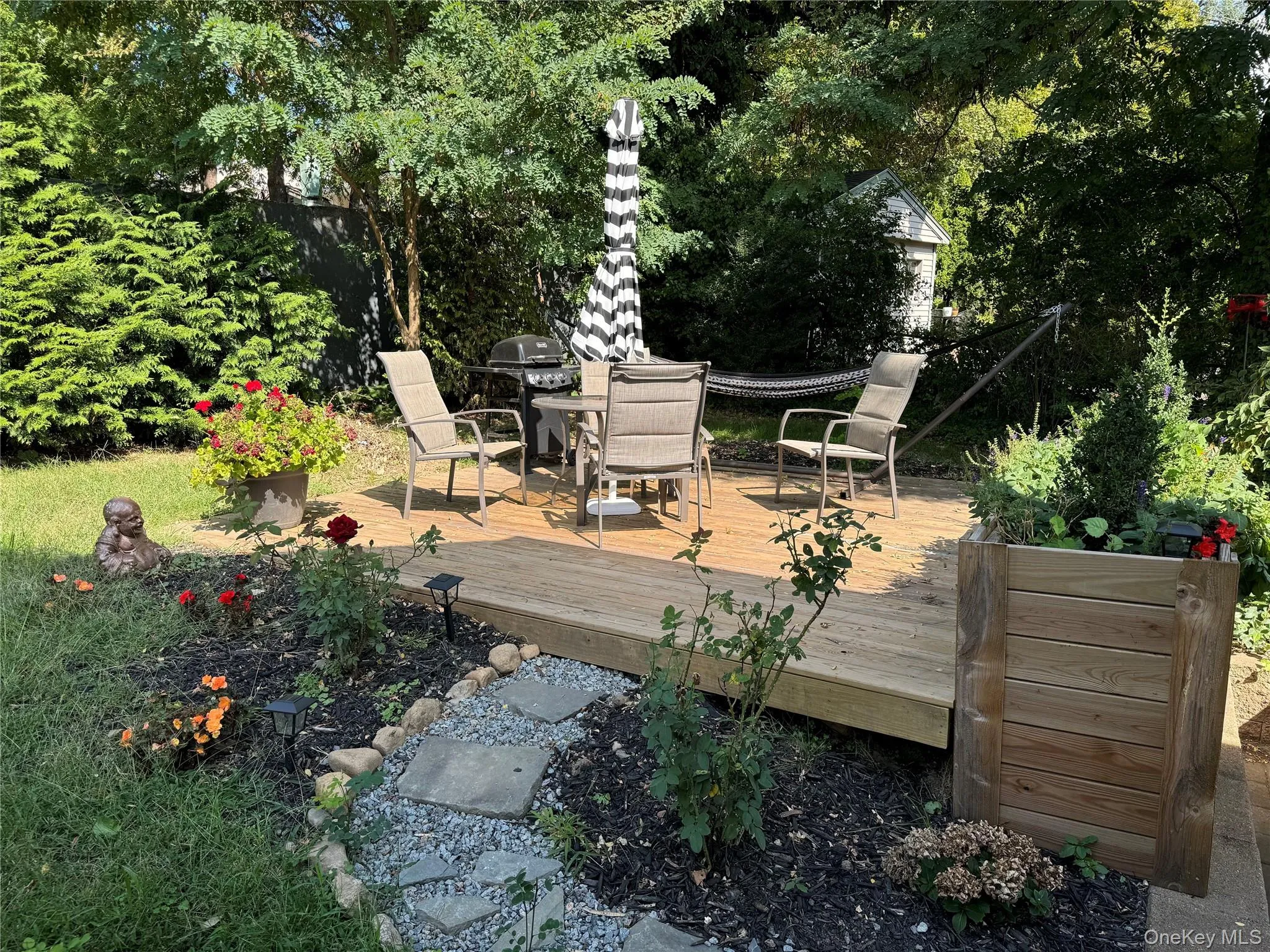 Wooden deck featuring outdoor dining area Wooden deck featuring outdoor dining area