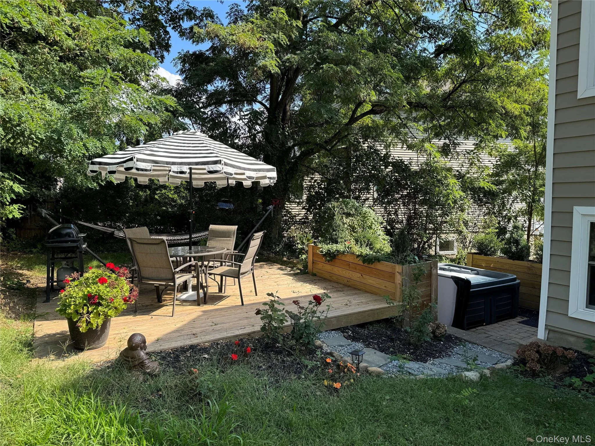 Deck with outdoor dining area and area for grilling Deck with outdoor dining area and area for grilling
