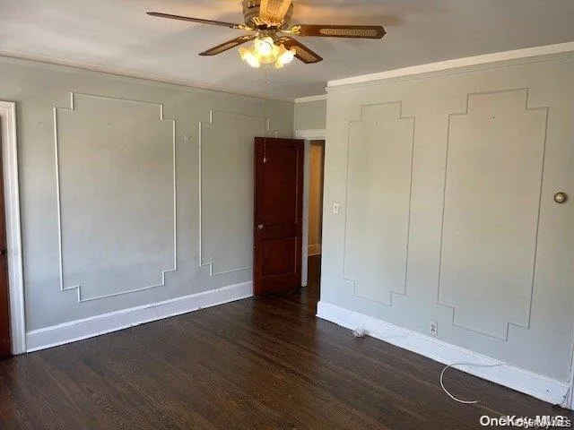 Large Living Space with Decorative Wall Paneling, High Ceilings Large Living Space with Decorative Wall Paneling, High Ceilings
