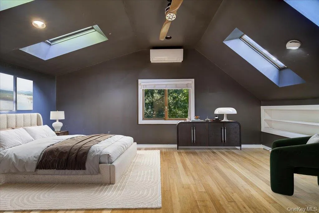 Large primary bedroom with skylights and private ensuite bathroom. (Virtually Staged) Large primary bedroom with skylights and private ensuite bathroom. (Virtually Staged)
