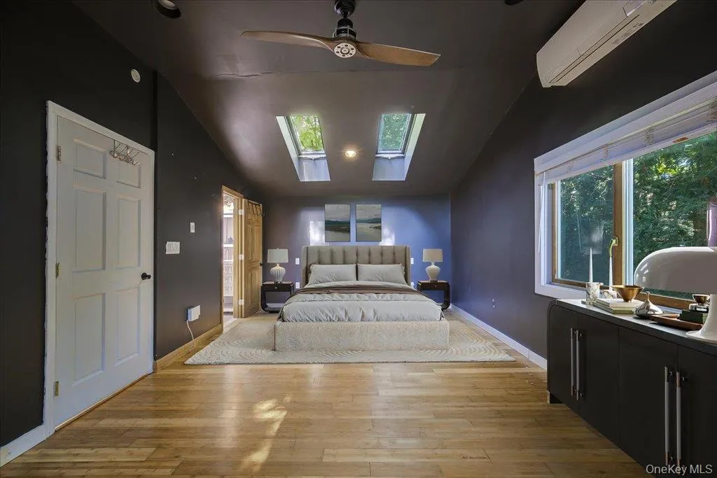 Large primary bedroom with skylights and private ensuite bathroom. Large primary bedroom with skylights and private ensuite bathroom.