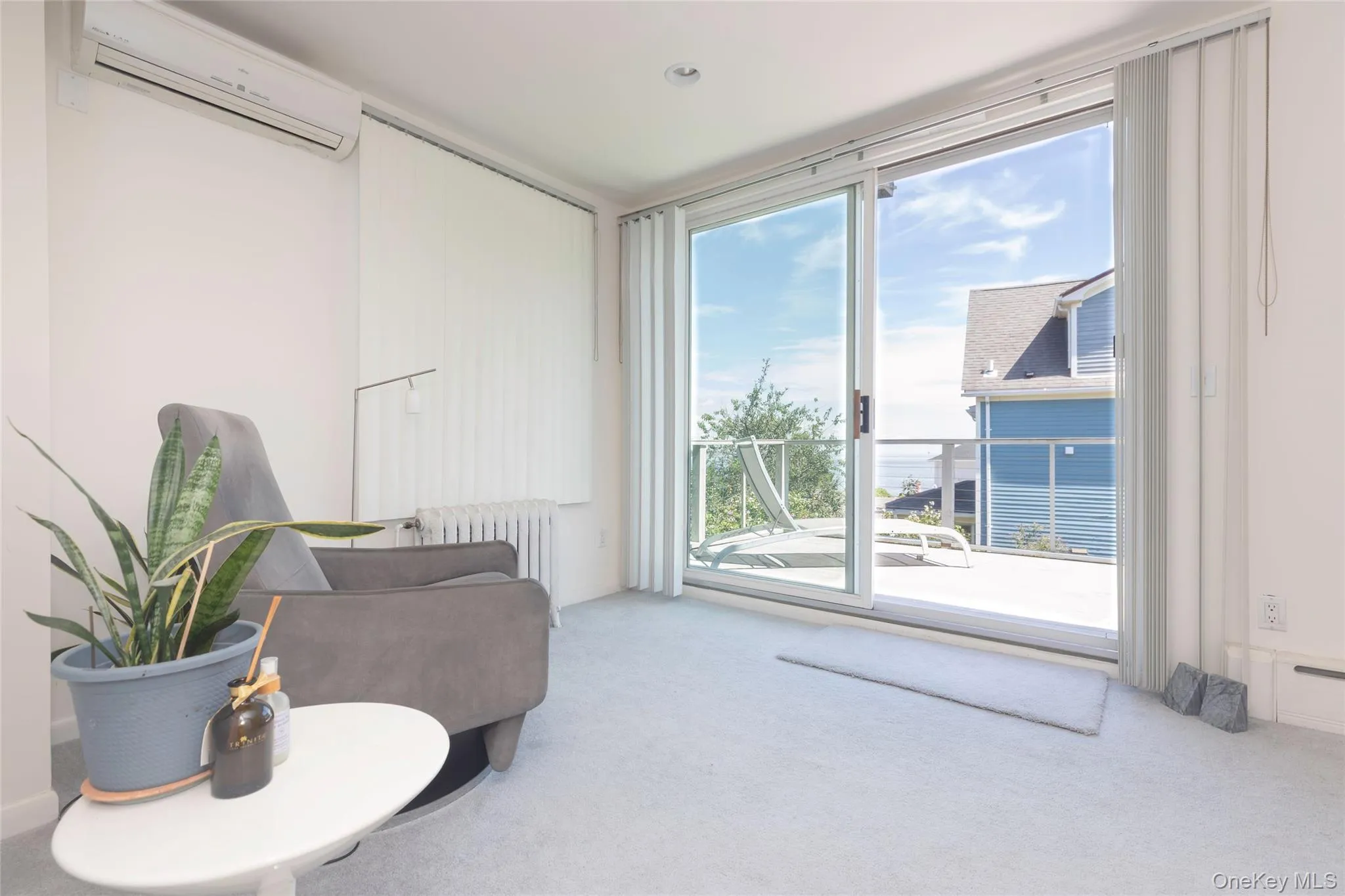 Sitting area in main bedroom sliders to outside deck. Sitting area in main bedroom sliders to outside deck.