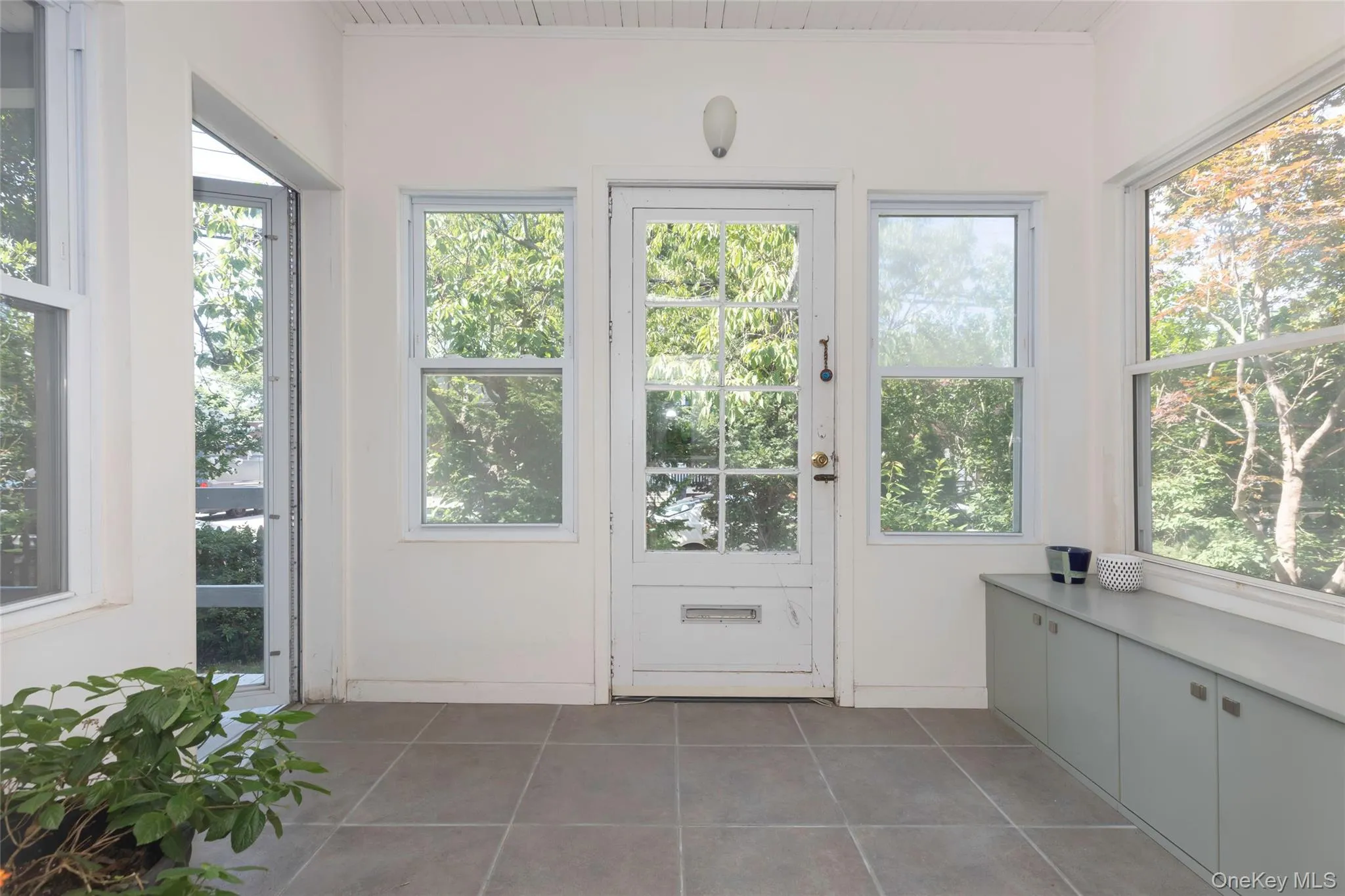 Front entrance enclosed porch with entrance to side porch Front entrance enclosed porch with entrance to side porch