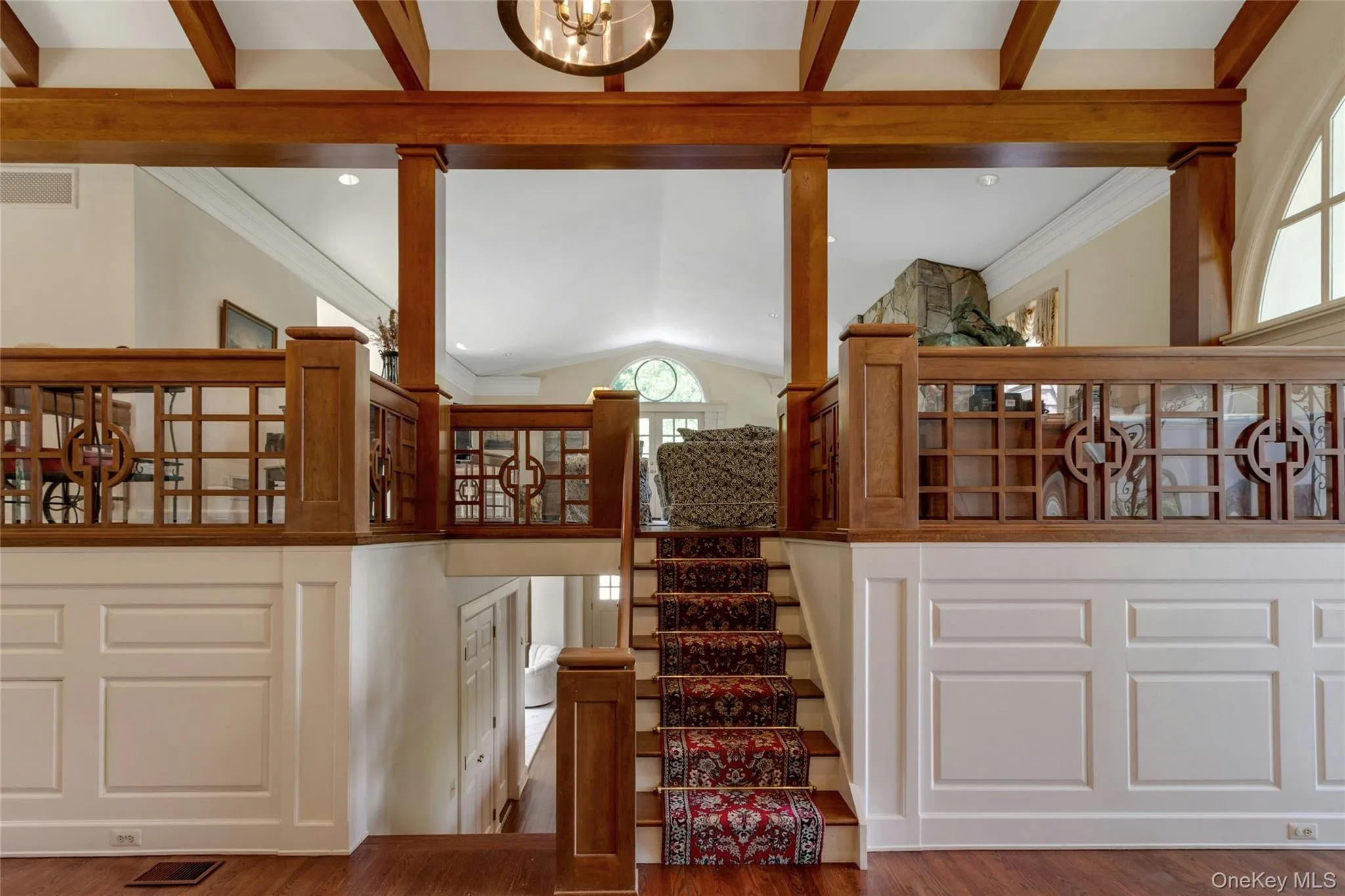 Steps to the living room, highlighting wood work Steps to the living room, highlighting wood work