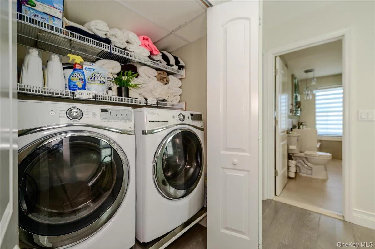 Stacked washer and dryer with wire shelving Stacked washer and dryer with wire shelving