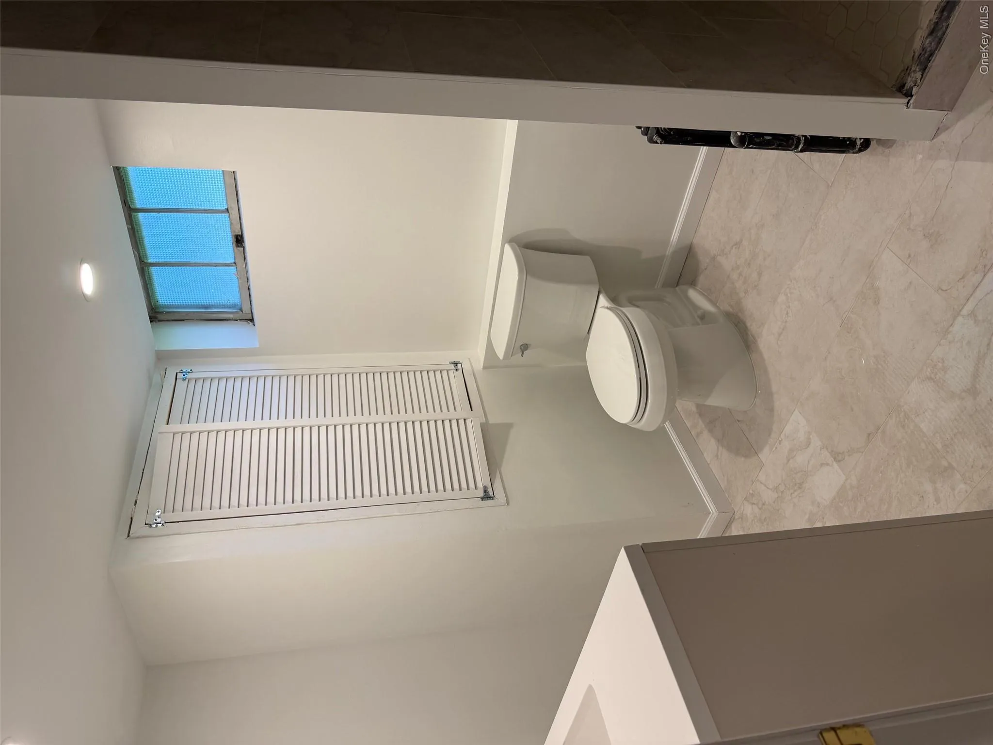 Full bath featuring toilet, vanity, baseboards, a shower stall, and recessed lighting Full bath featuring toilet, vanity, baseboards, a shower stall, and recessed lighting