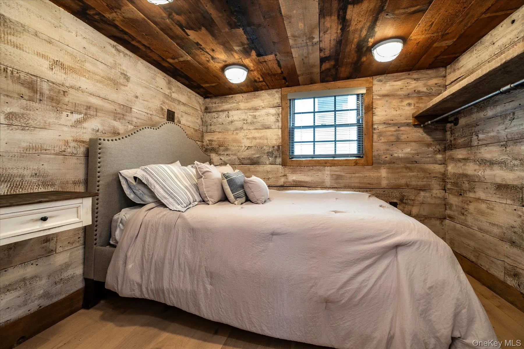 Bedroom with reclaimed wood and flush mount lights Bedroom with reclaimed wood and flush mount lights