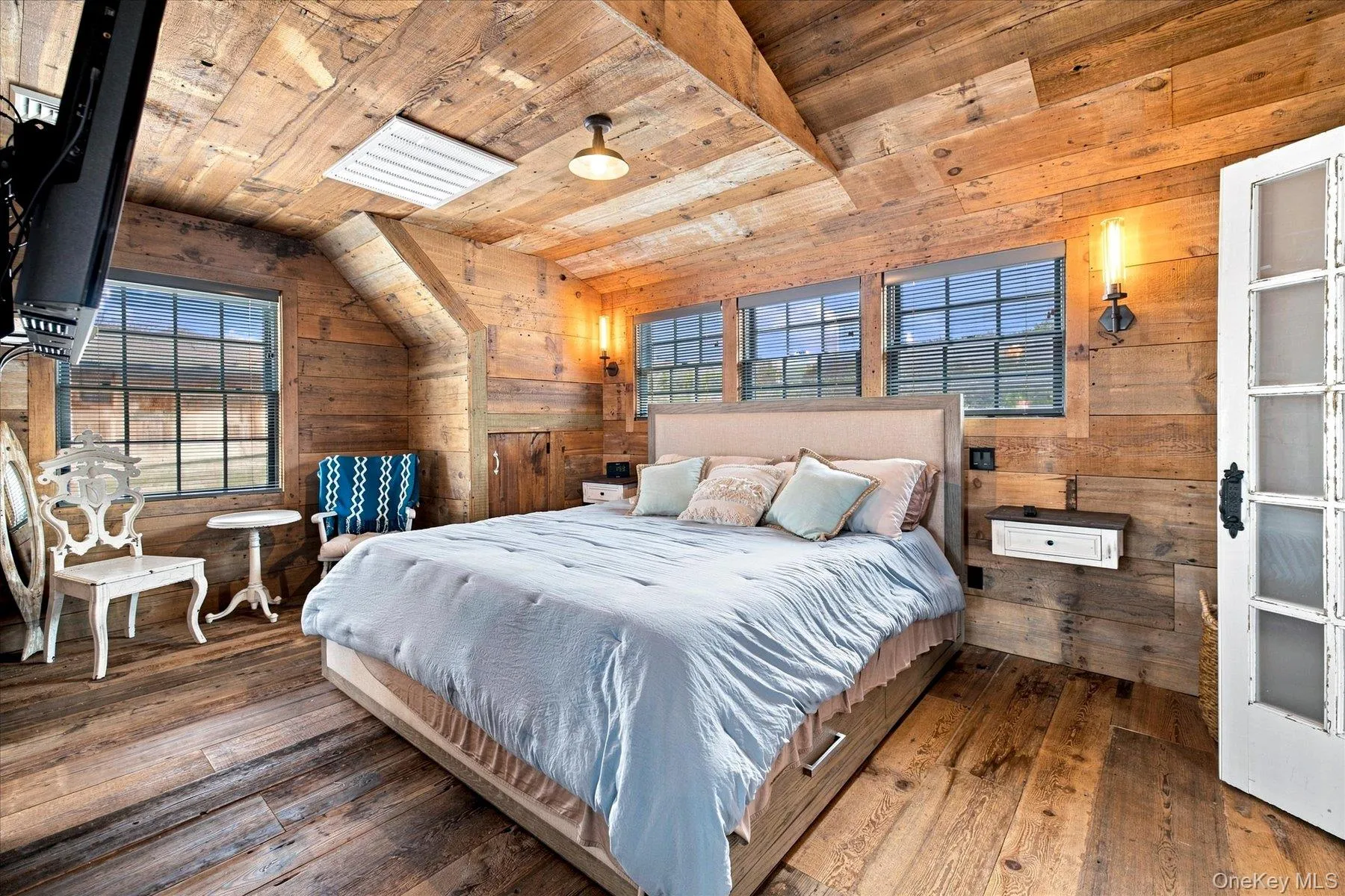 Wood-paneled walls and ceilings throughout Wood-paneled walls and ceilings throughout