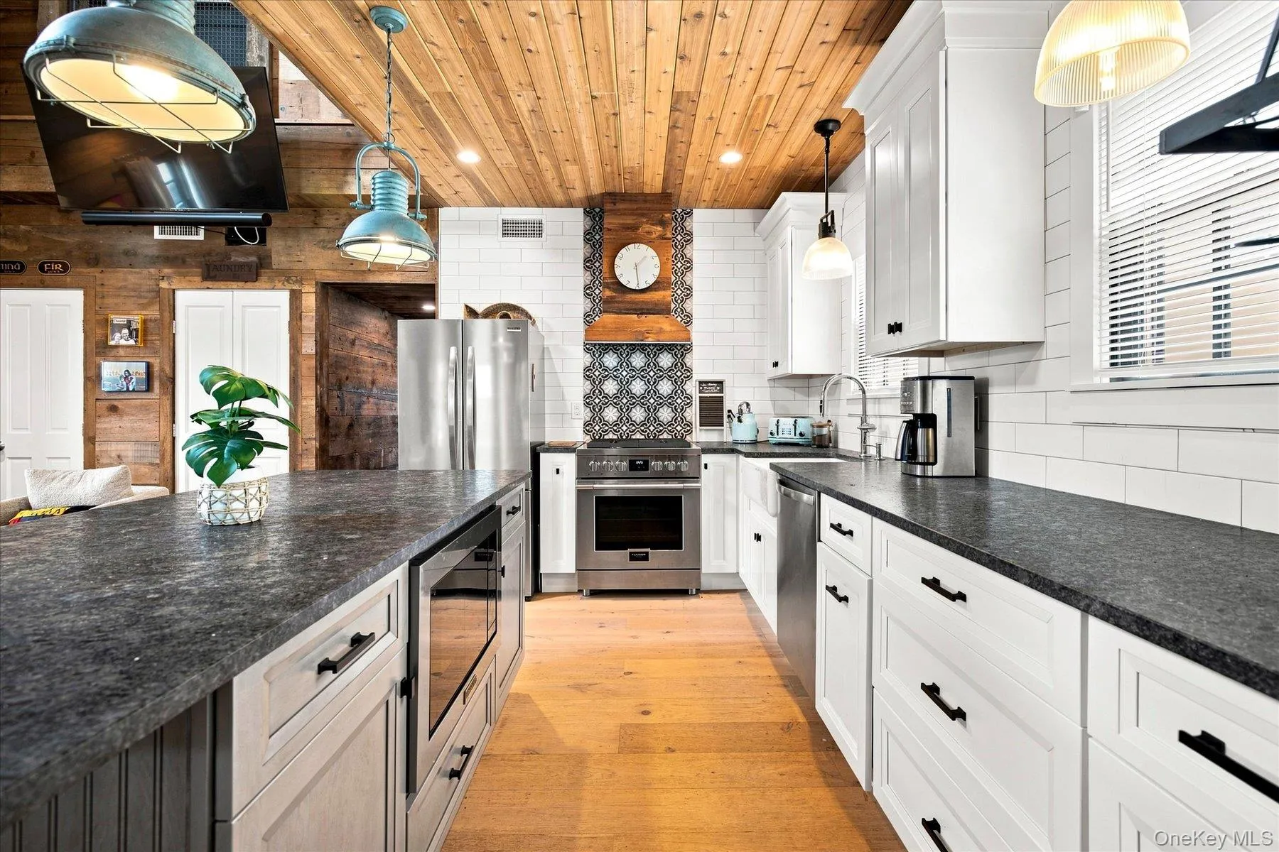 Brand new kitchen with stainless steel appliances, and subway tile backsplash Brand new kitchen with stainless steel appliances, and subway tile backsplash
