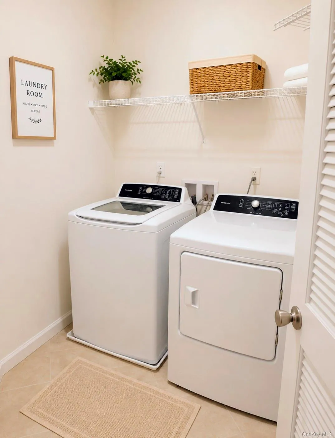 Dedicated laundry area featuring wire shelving, tile flooring, and louvered door Dedicated laundry area featuring wire shelving, tile flooring, and louvered door