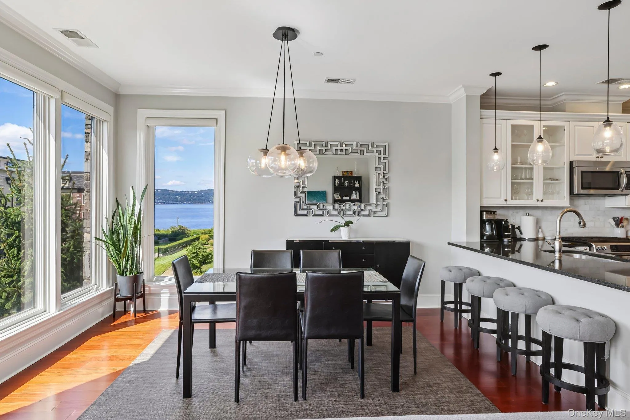 Hardwood flooring throughout, a modern chandelier, and river views Hardwood flooring throughout, a modern chandelier, and river views
