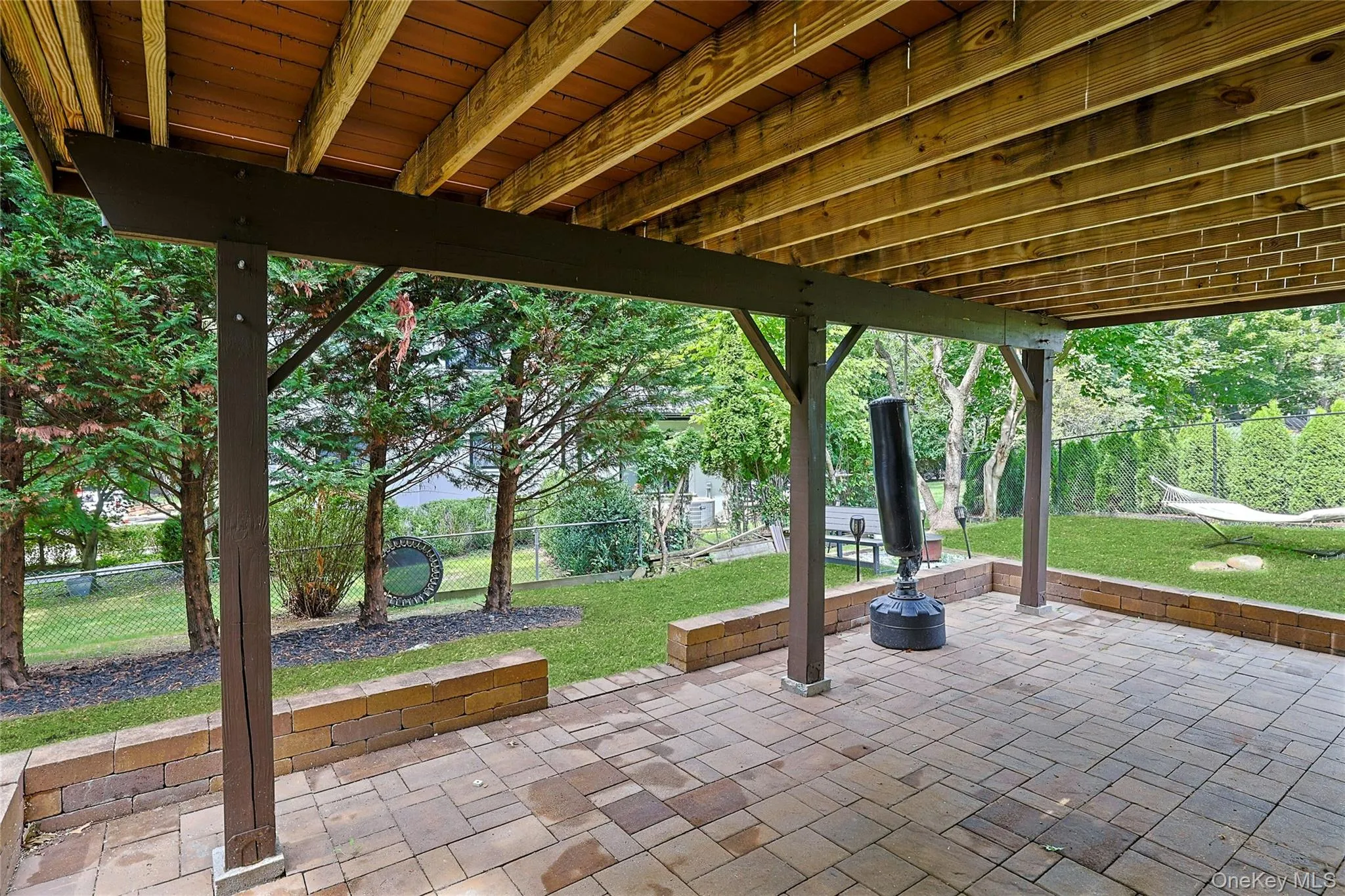 Covered patio with separate entrance to lower level. Covered patio with separate entrance to lower level.