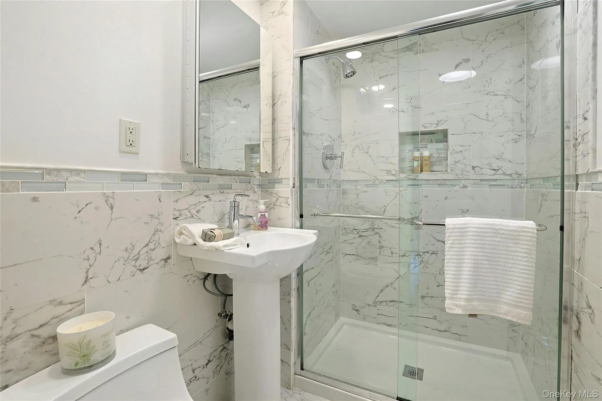 Lower level bathroom with glass shower. Lower level bathroom with glass shower.