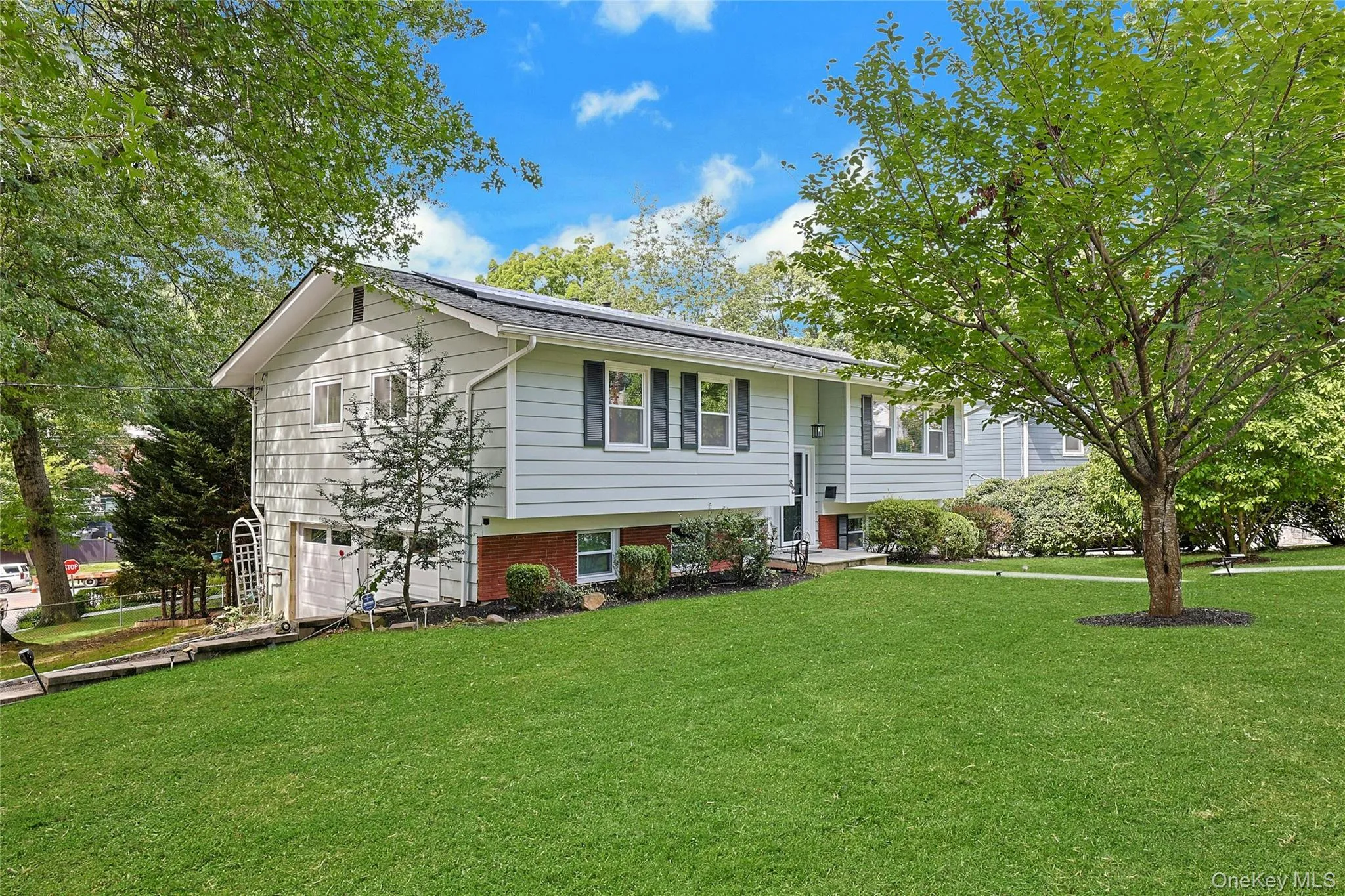 Positioned on a corner property and surrounded by greenery. Positioned on a corner property and surrounded by greenery.