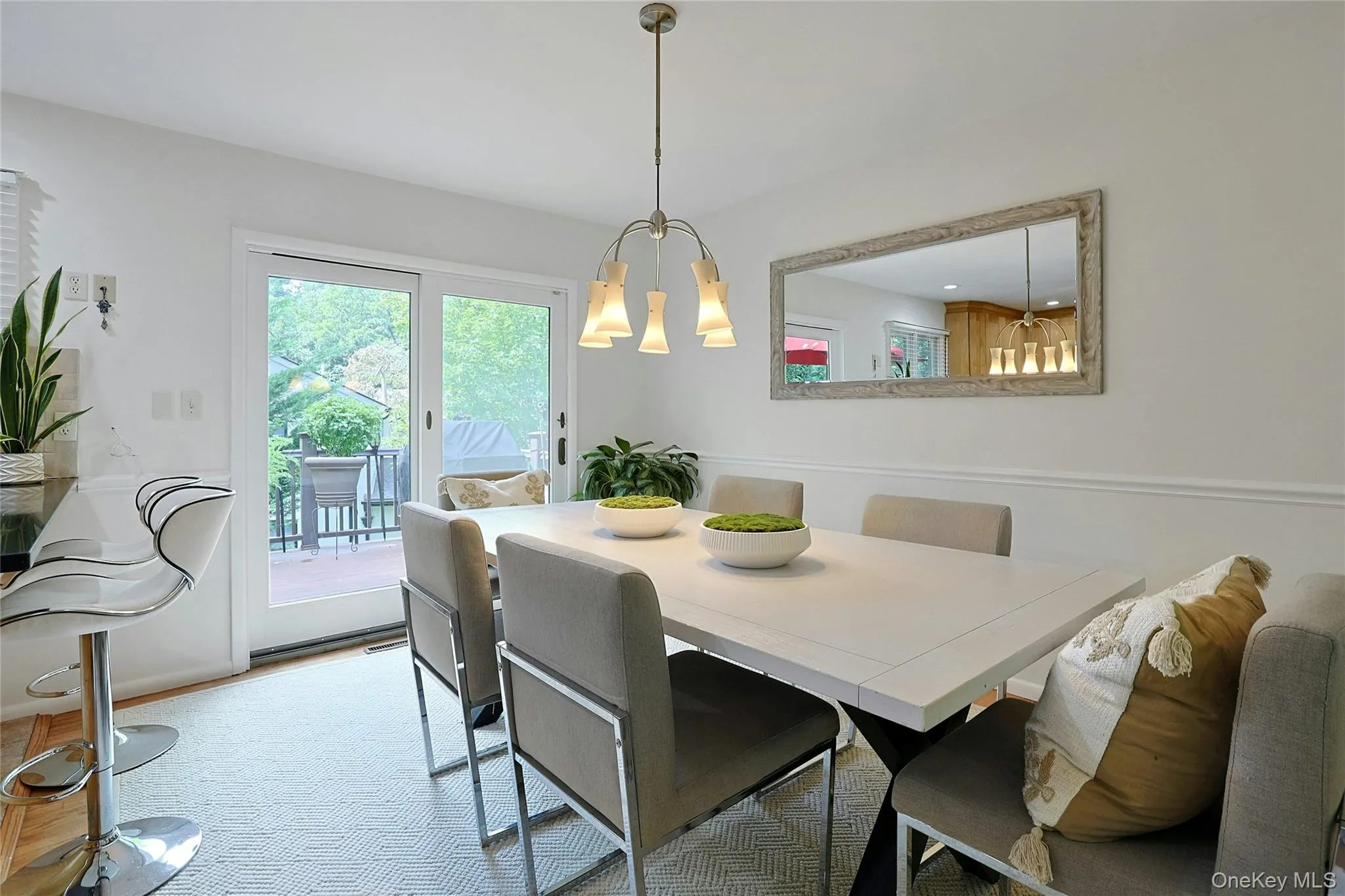 Dining room with glass doors to the deck. Dining room with glass doors to the deck.