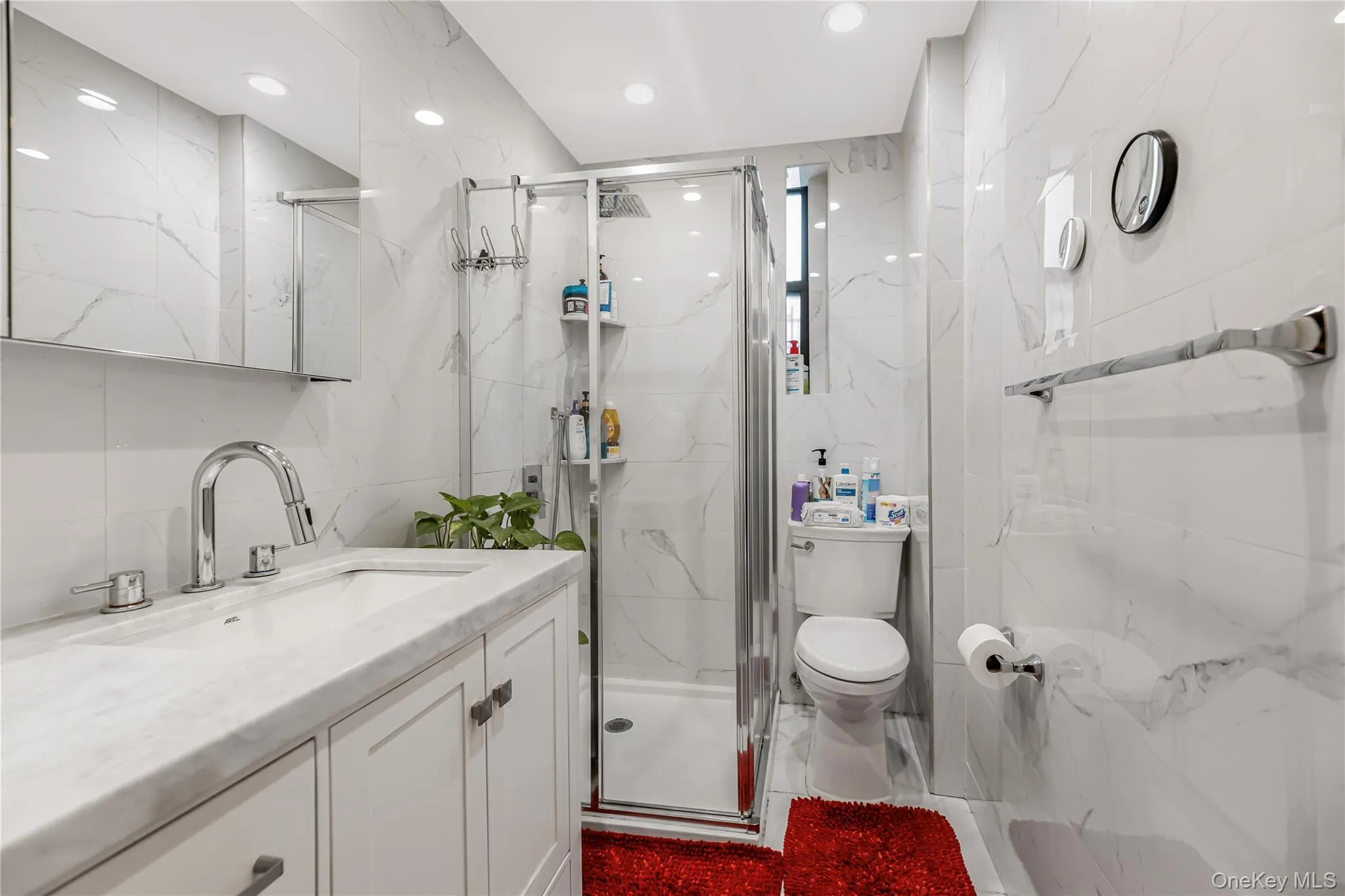 Upgraded bathroom, wall to wall marble tiles and granite sink/countertop Upgraded bathroom, wall to wall marble tiles and granite sink/countertop
