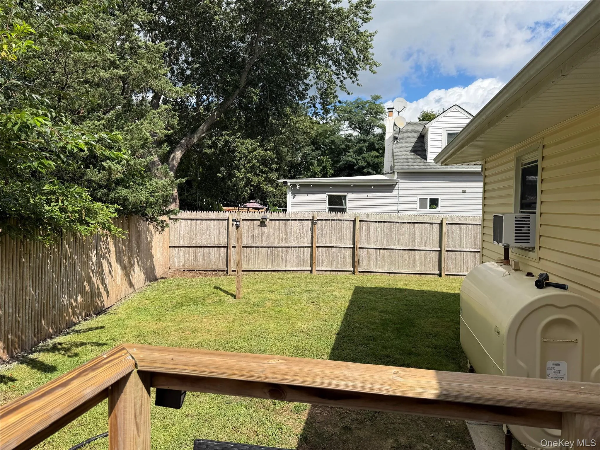 New deck overlooking spacious yard. Fully fenced with area for pets. New deck overlooking spacious yard. Fully fenced with area for pets.