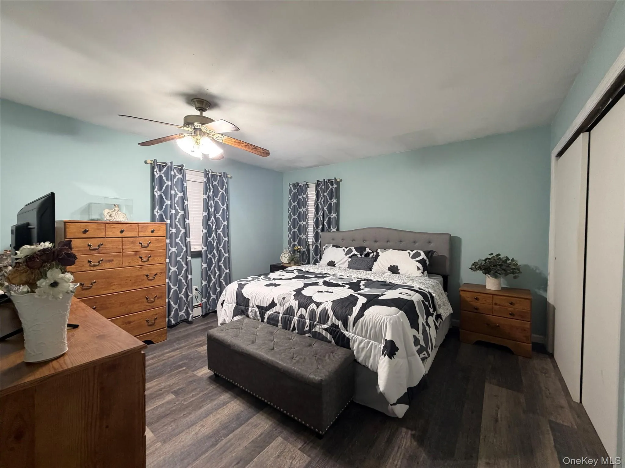 Large primary bedroom with king sized bed. Large primary bedroom with king sized bed.